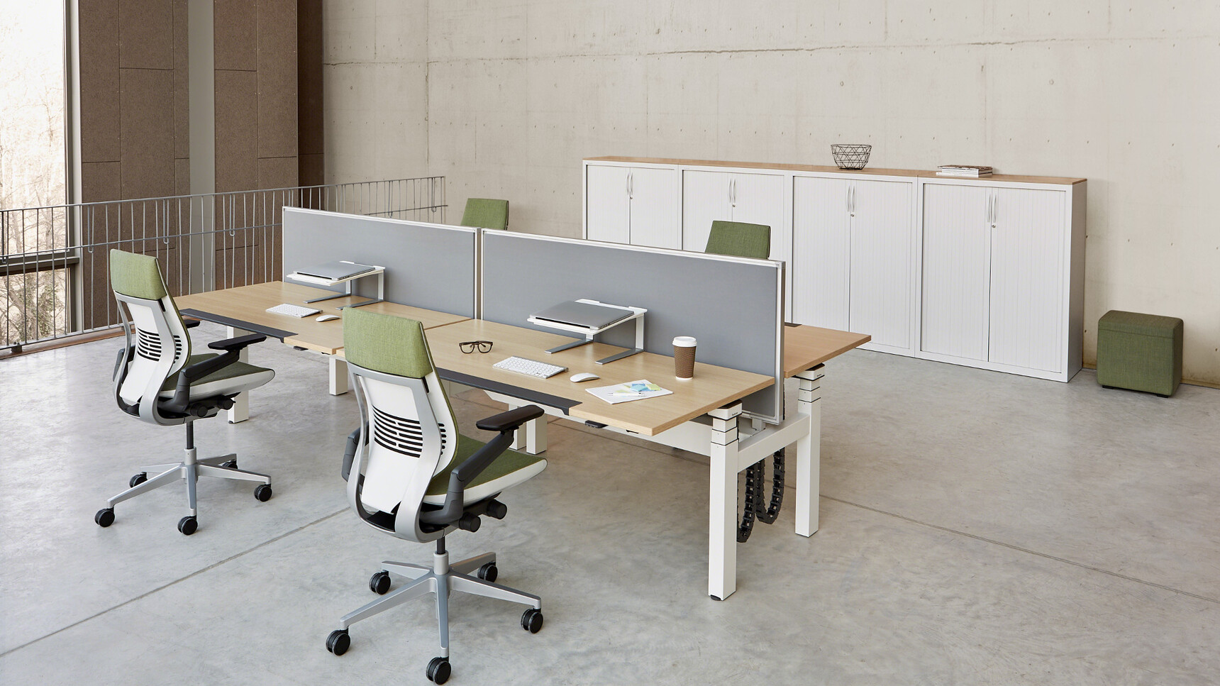 Two Steelcase Ology Height Adjustable Bench Desks With Simple Touch With Wood Table Tops And White Legs And Four Gesture Wrapped Back Chairs At Desk