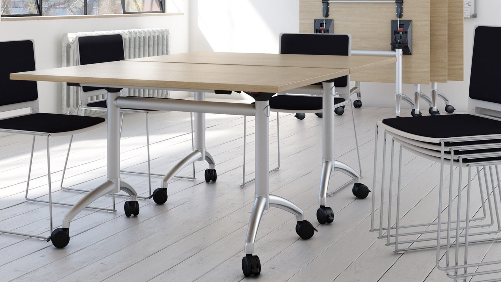Five Elite Flip Top Rectangular Tables With Light Wood Finish And Silver Metal Leg Finish On Castors With Seven Black Elite Office Chairs In Office Environment