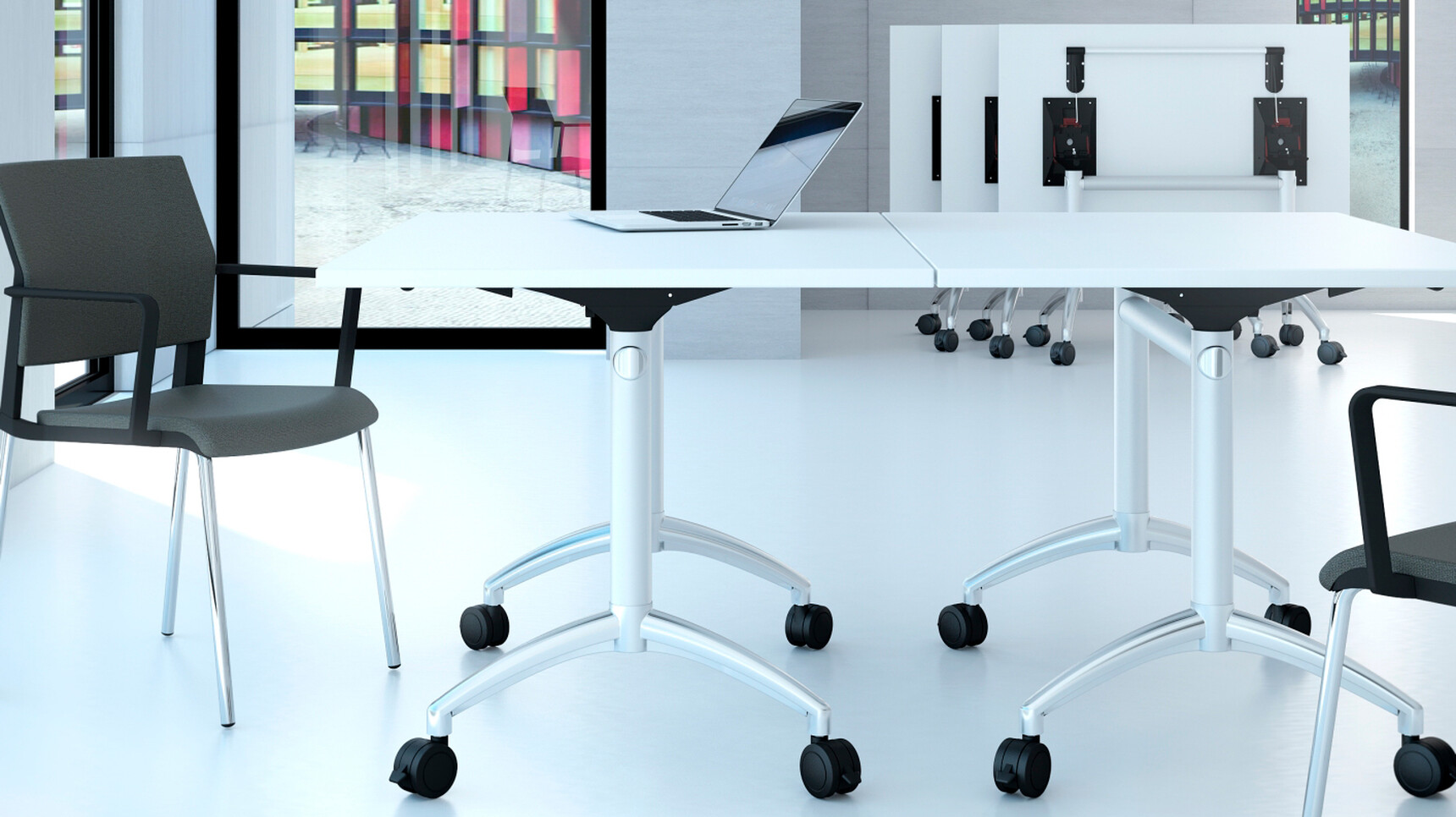 Five Elite Flip Top Rectangular Tables With White Finish And Silver Metal Leg Finish On Castors With Two Black Chairs In Office Environment