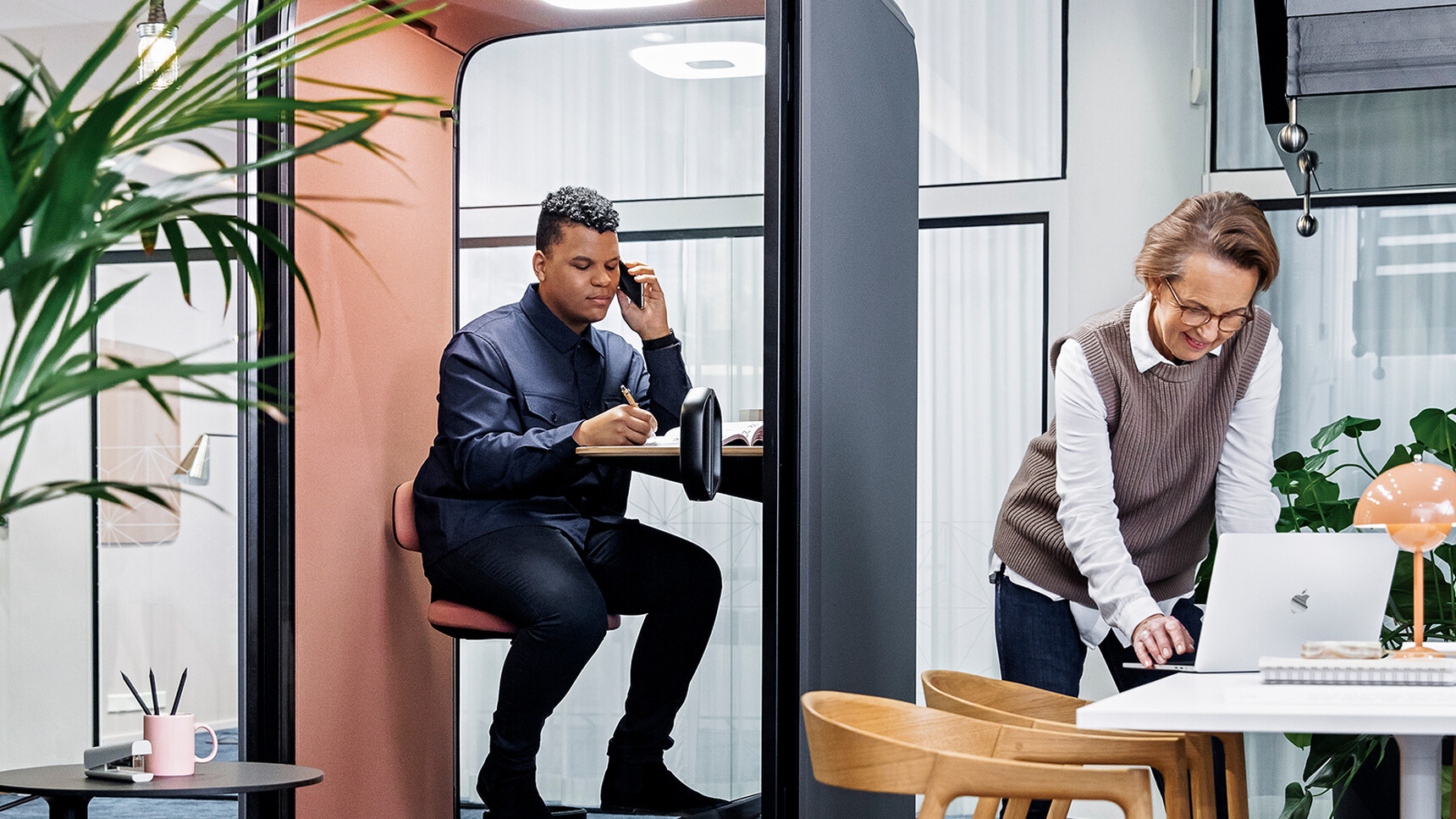 Framery One Meeting Pod In Black Finish In Use With Person On Phone