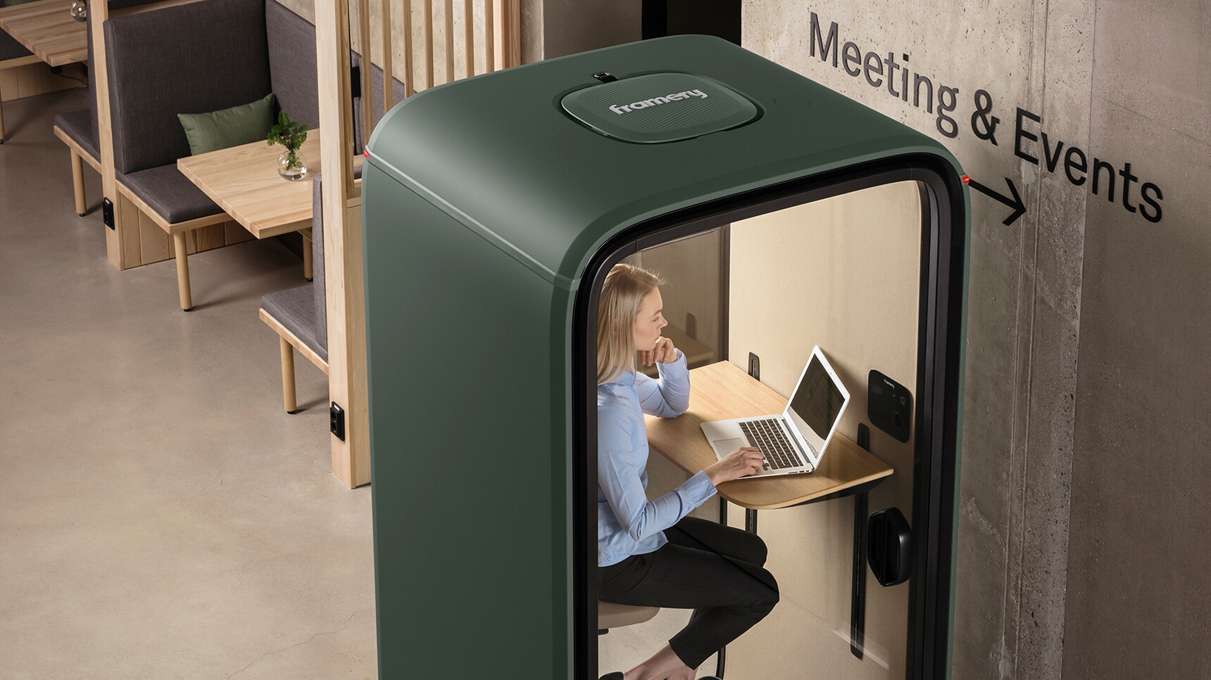 Framery One Meeting Pod In Dark Green Finish In Use With A Person On A Laptop