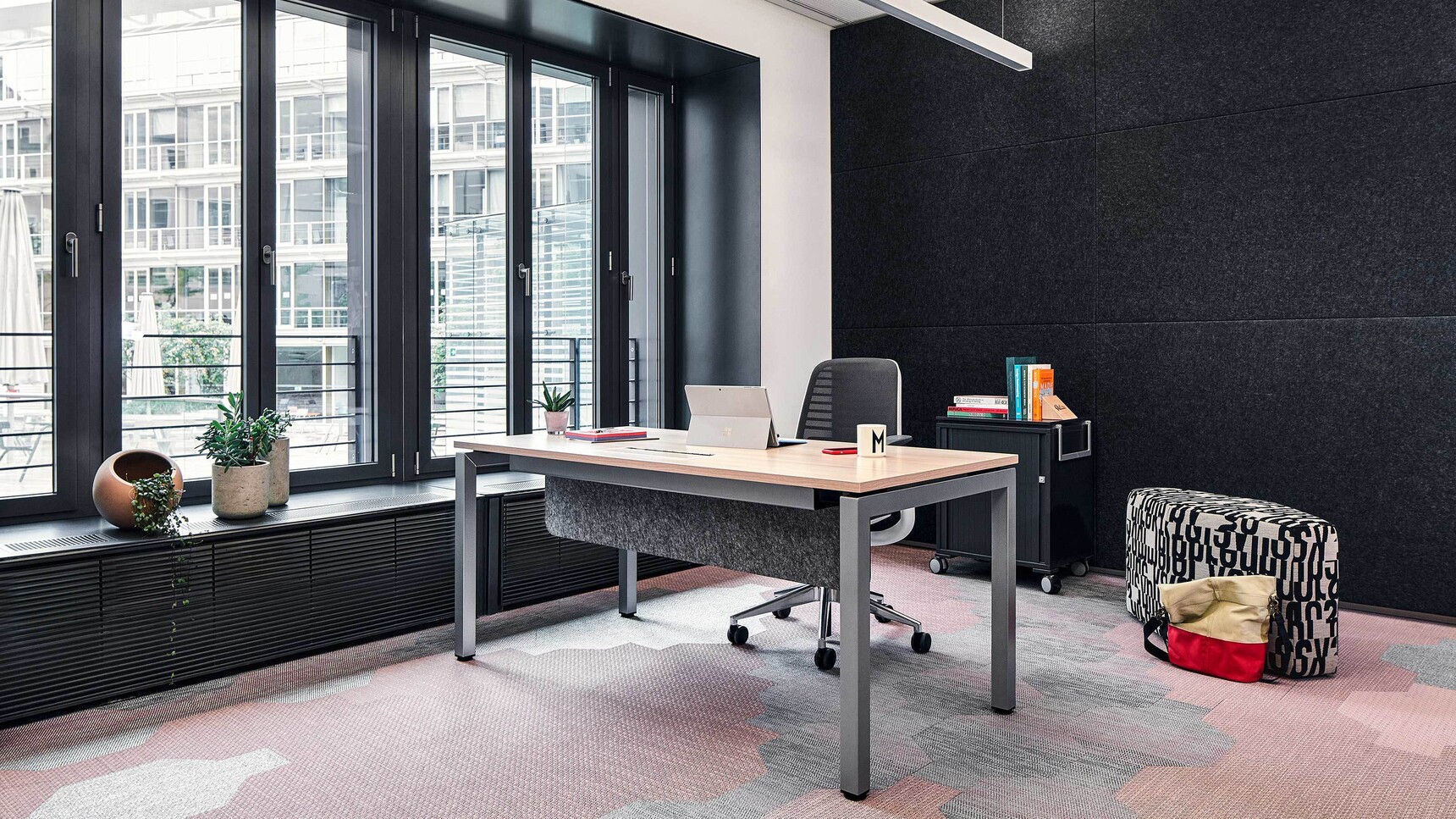 Steelcase Ottima Portico Fixed Height Desk With Wood Table Top Finish And Grey Leg Finish And Modesty Panel In Office Setting