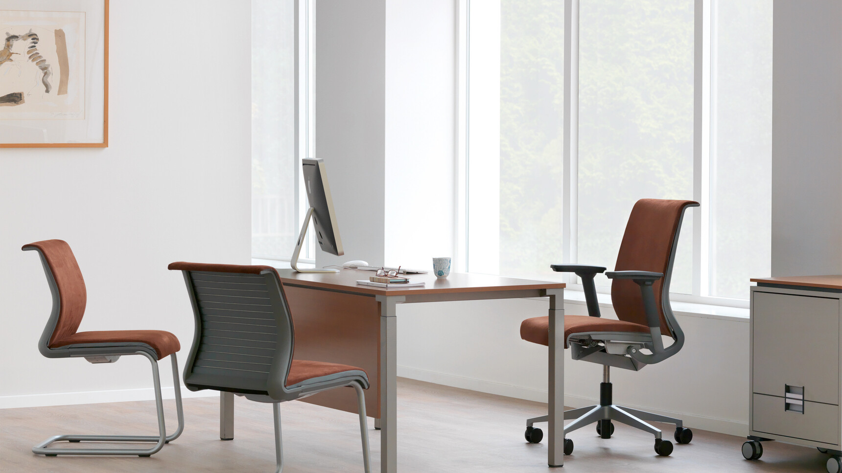 Steelcase Kalidro Fixed Height Desk With Wood Table Top And Grey Leg Finish With Chairs At Desk In Executive Office