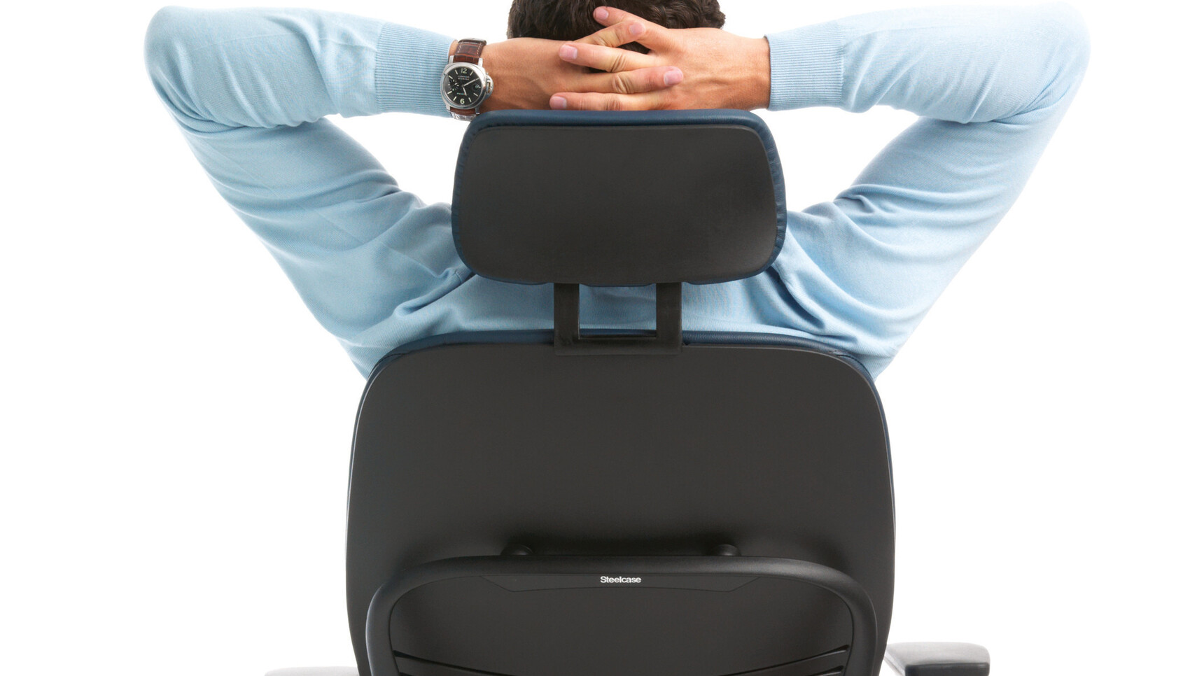 Steelcase Leap V2 Office Chair With Headrest With Blue Upholstery In Use By A Person Using The Headrest