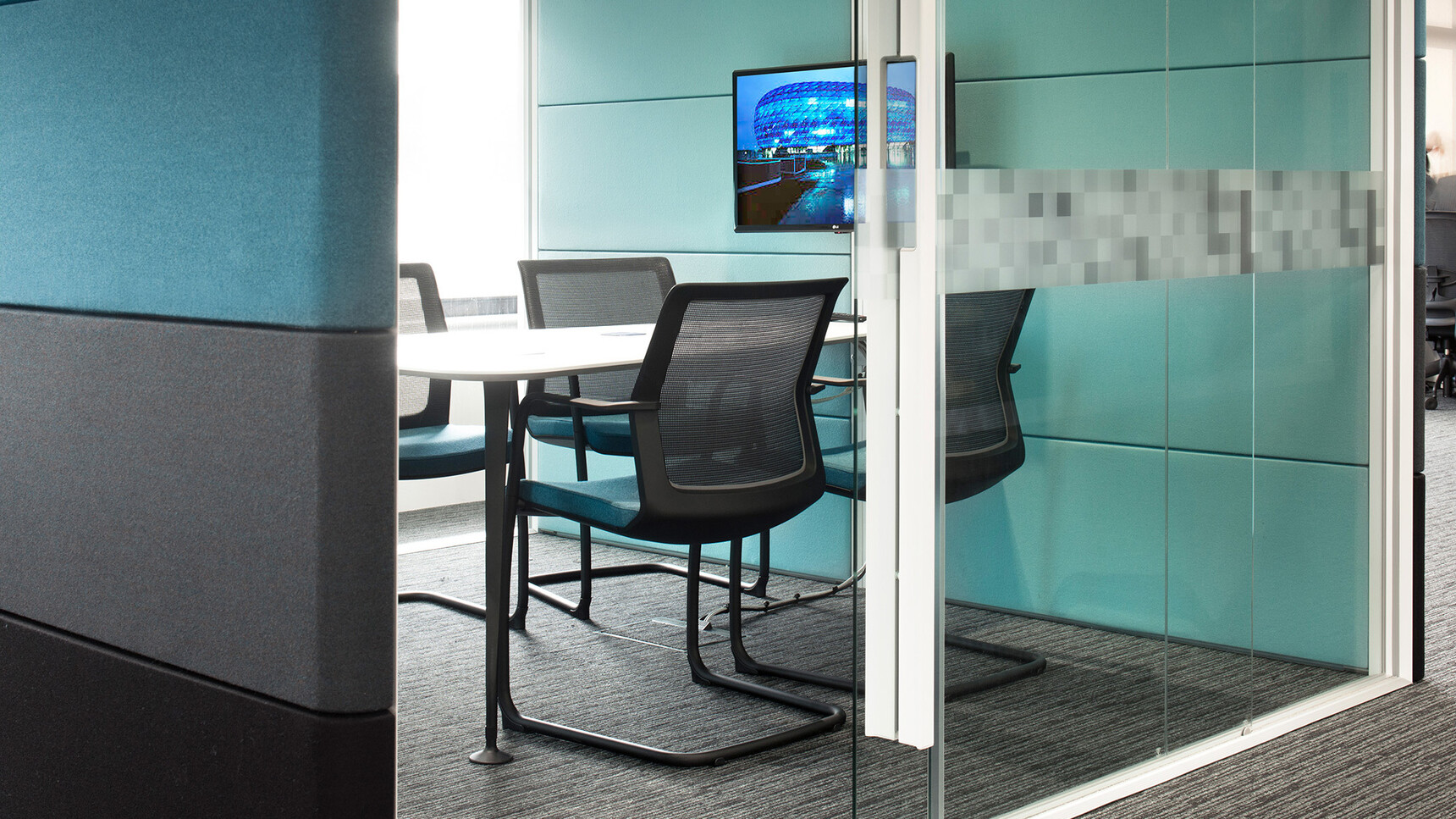 Orangebox Workday Cantilever Armchairs With Blue Seat Upholstery And Black Backrest And Legs At Table In Meeting Room