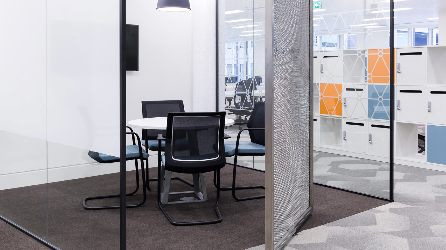 Orangebox Workday Cantilever Armchairs With Blue Seat Upholstery And Black Leg Finish At Meeting Table In Meeting Room