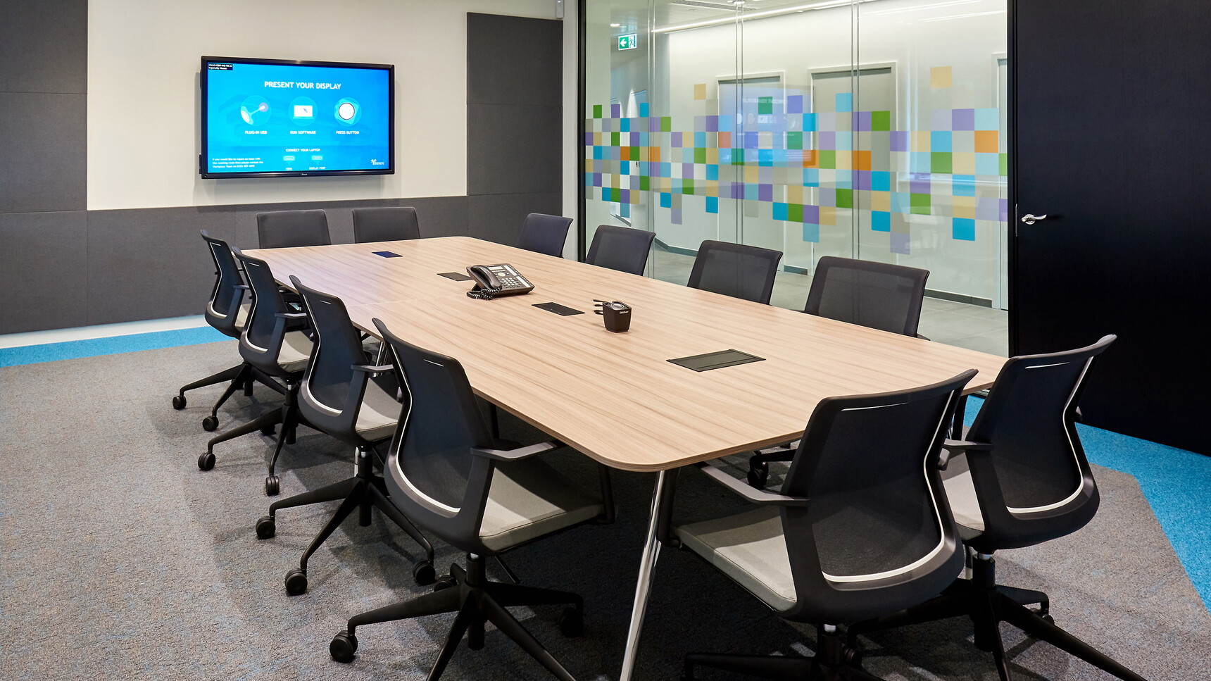 Orangebox Workday Lite Work Armchairs With Black Frames At Meeting Table