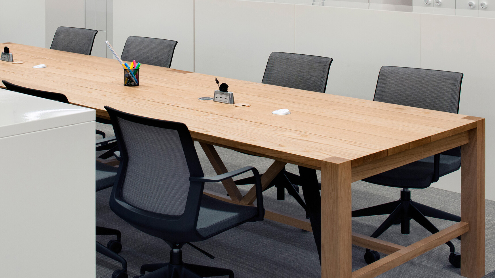 Orangebox Workday Lite Work Armchairs With Black Frame At Wood Table Detail Image