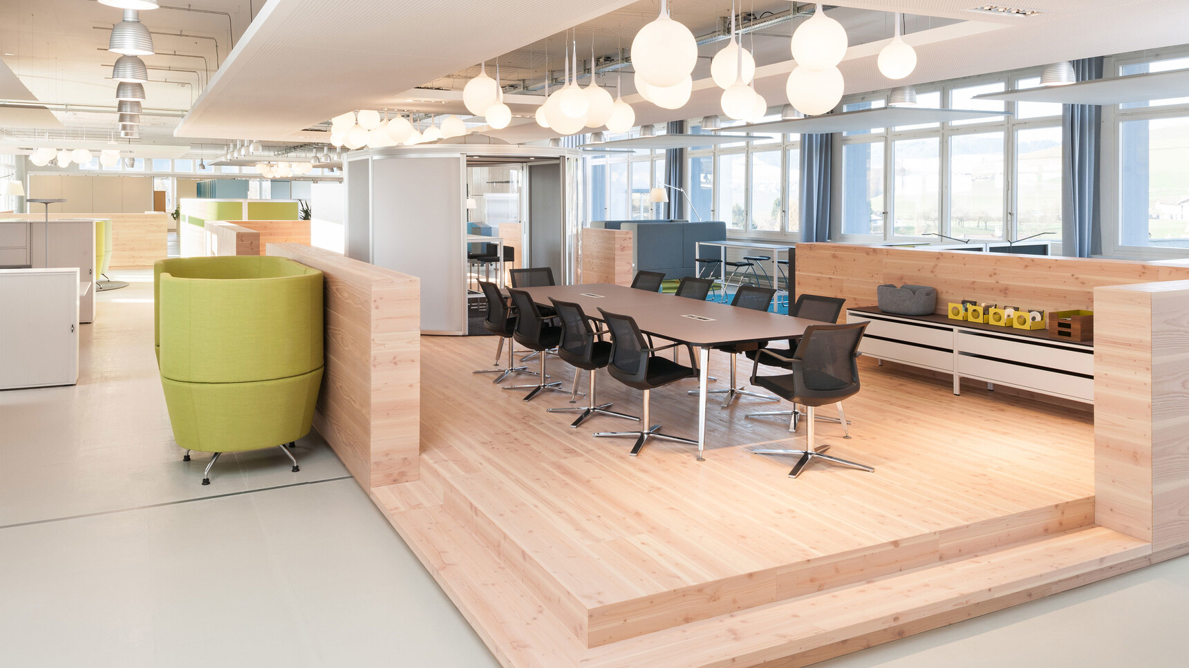 Orangebox Workday Conference Armchair In Black Finish At Meeting Table In Office Setting
