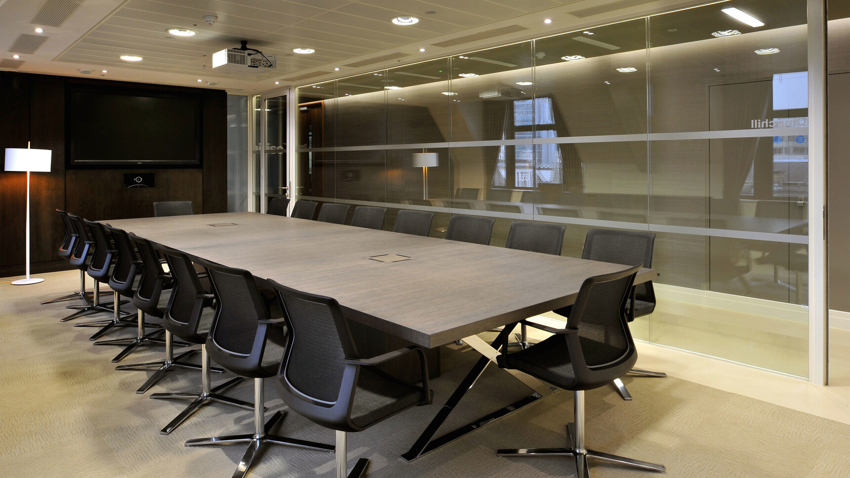 Orangebox Workday Conference Armchairs In Black Upholstery And Black Frame With Polished Base At Meeting Table In Office Environment