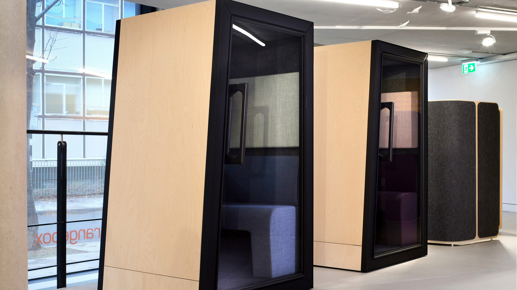 Orangebox On The QT Personal Pods In Wood Finish And Black Finish In Office Environment