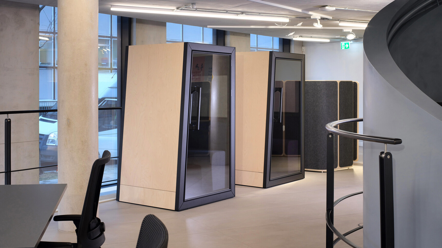 Orangebox On The QT Personal Pods In Wood And Black Finish In Office Setting