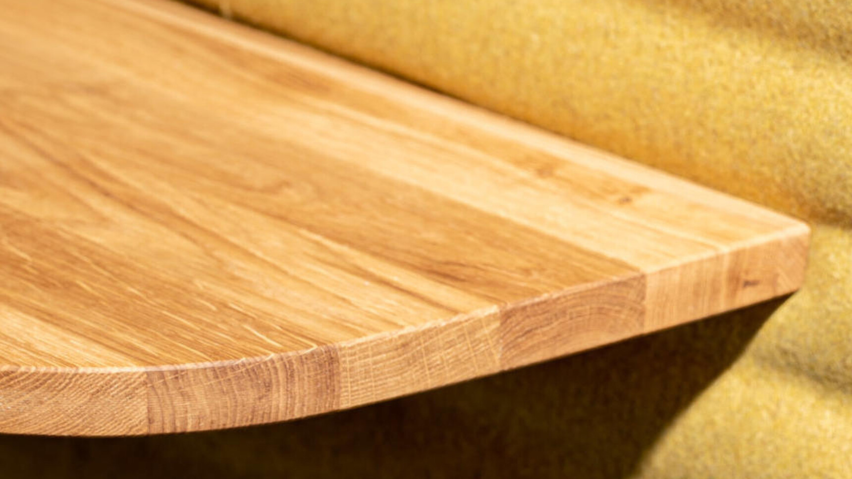 Buzzi Space BuzziNest Booth With Yellow Interior And Wood Table Detail Image