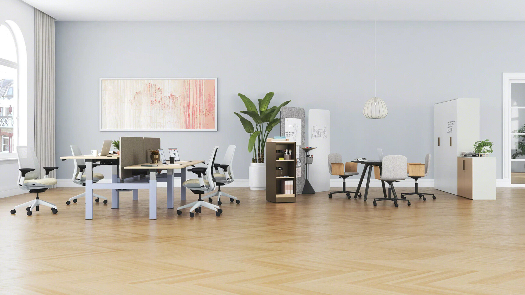 Steelcase Migration SE H-Bench Height Adjustable Bench Desk Family Image In Office Setting