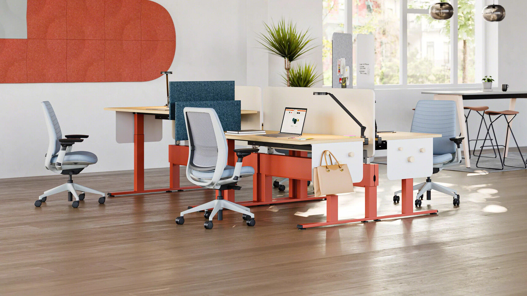 Steelcase Migration SE Height Adjustable Bench Desk With Orange Finish In Office Setting