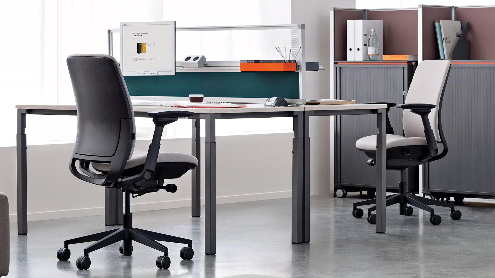 Two Steelcase Amia Task Chairs At Desk In Office Setting