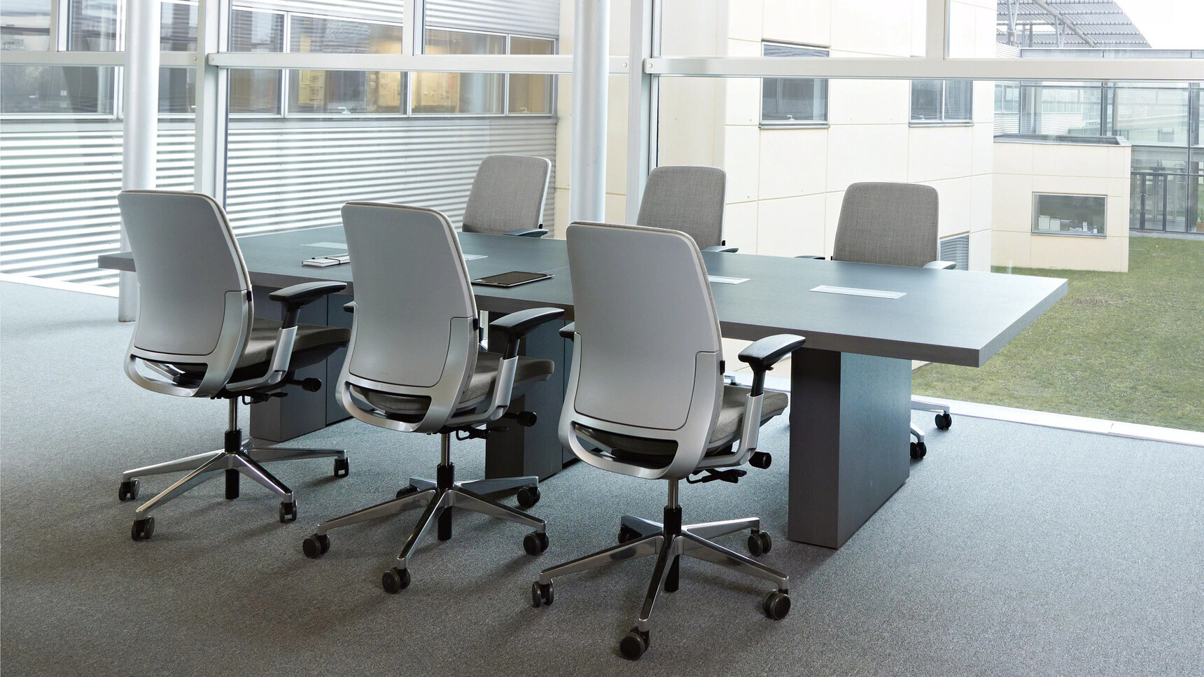 Six Steelcase Amia Platinum Office Task Chairs At Meeting Table In Office Setting