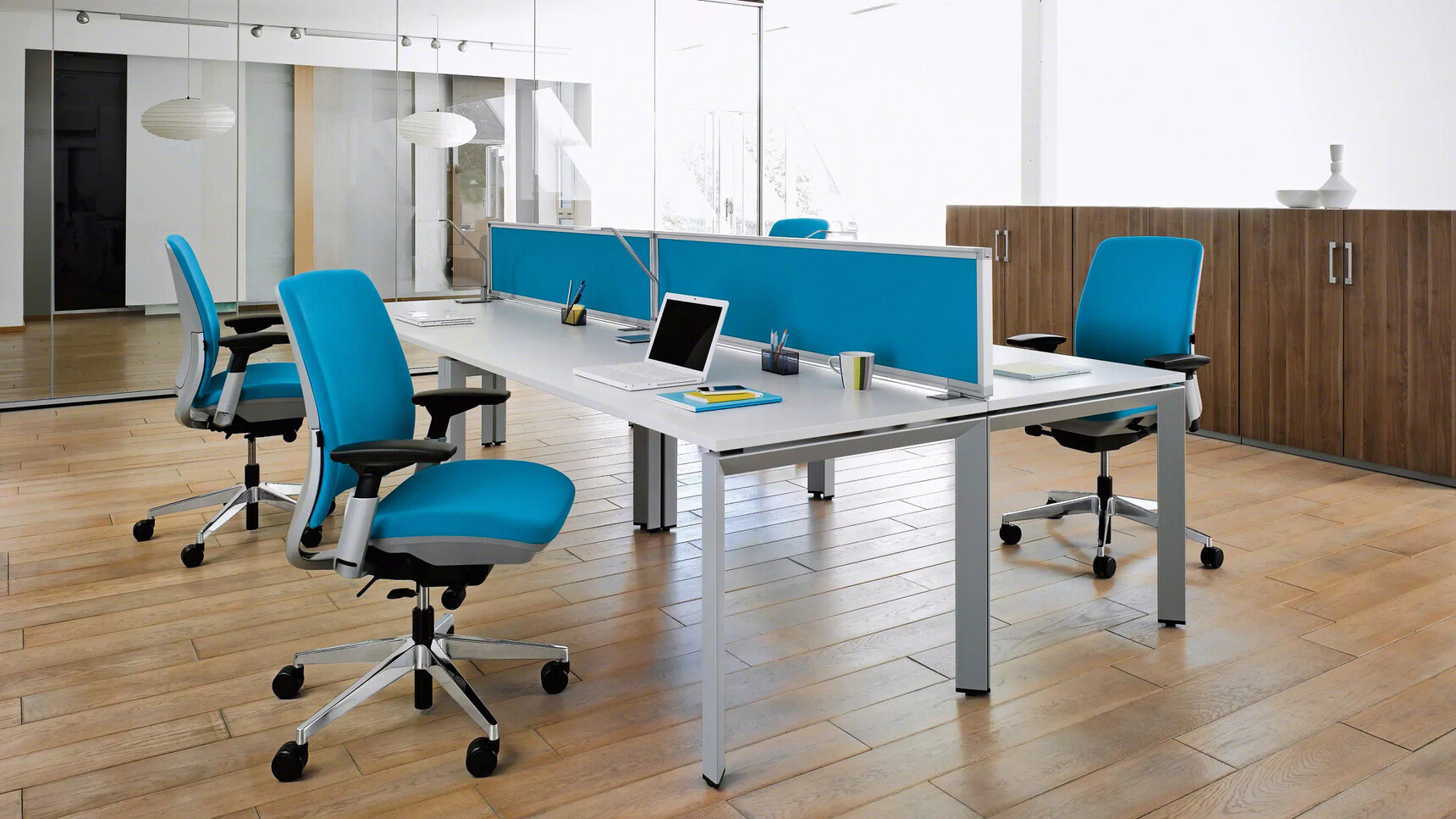 Four Steelcase Amia Platinum Office Task Chairs At Desk In Office Environment
