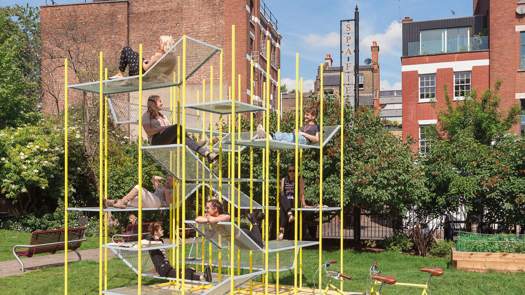 Buzzi Space BuzziJungle Tower High In Yellow Finish Family Image In Use By People Outside