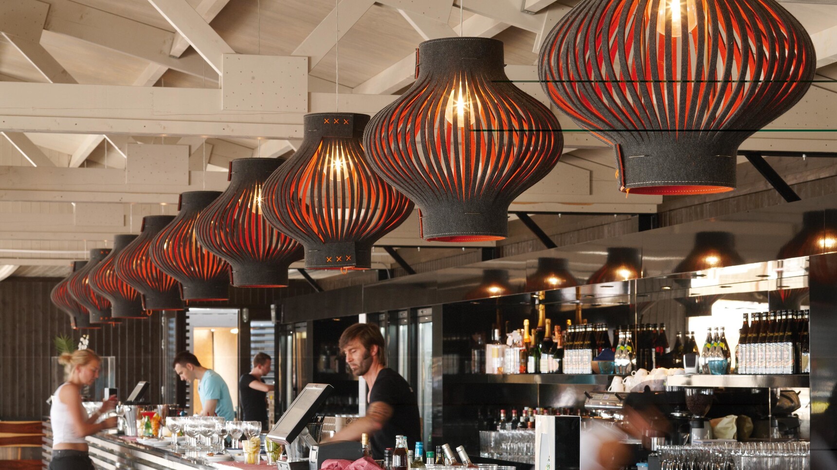 Buzzi Space BuzziLight Monos With Black And Orange Upholstery In Restaurant Setting