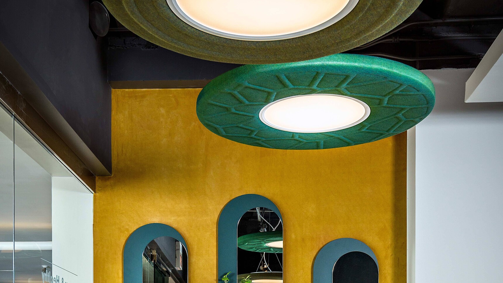 Buzzi Space BuzziMoon Round Acoustic Light With Green Fabric Finish In Office Environment