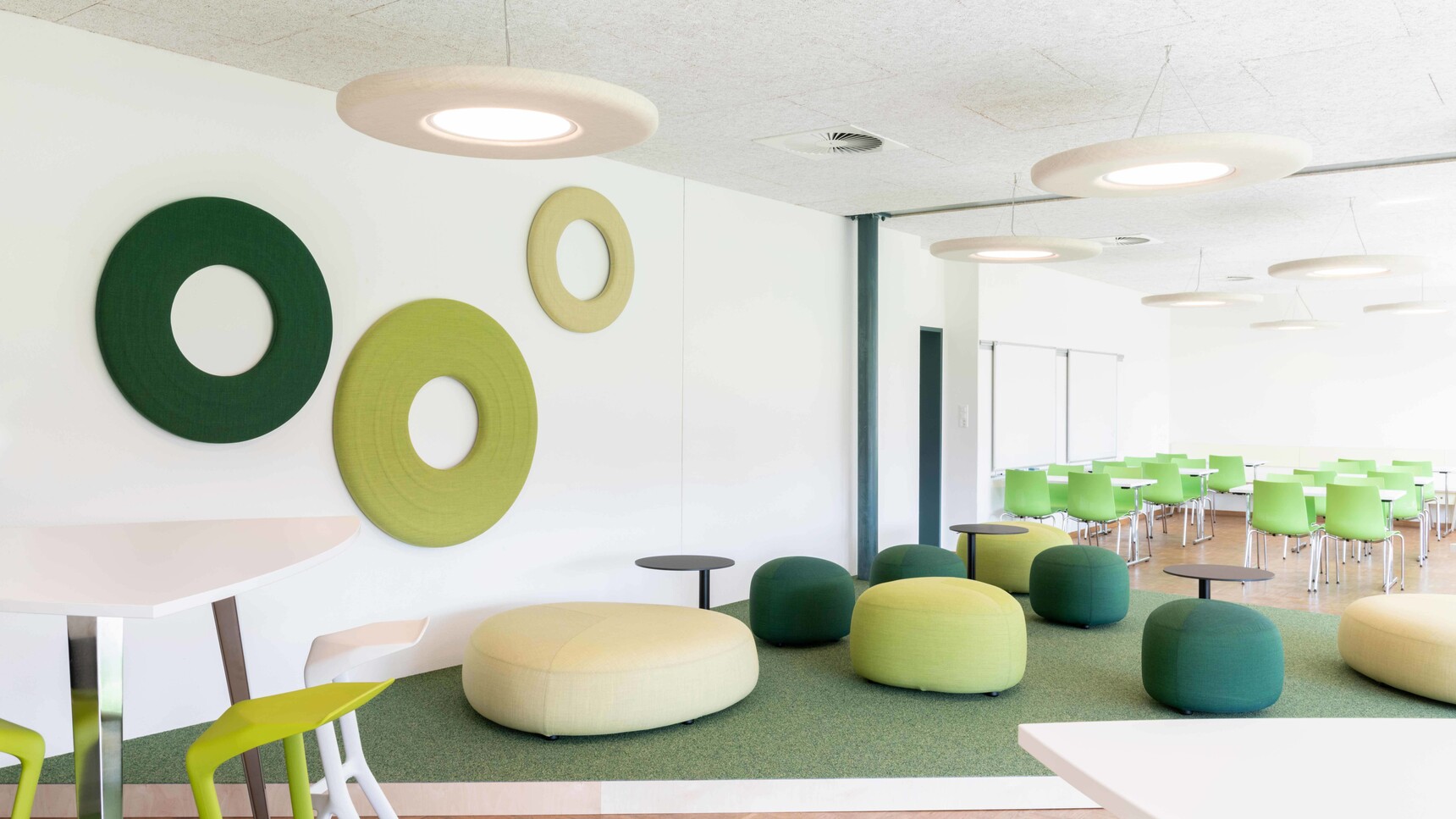 Two Buzzi Space BuzziMoon Round Acoustic Lights With White Fabric Finish In Office Setting