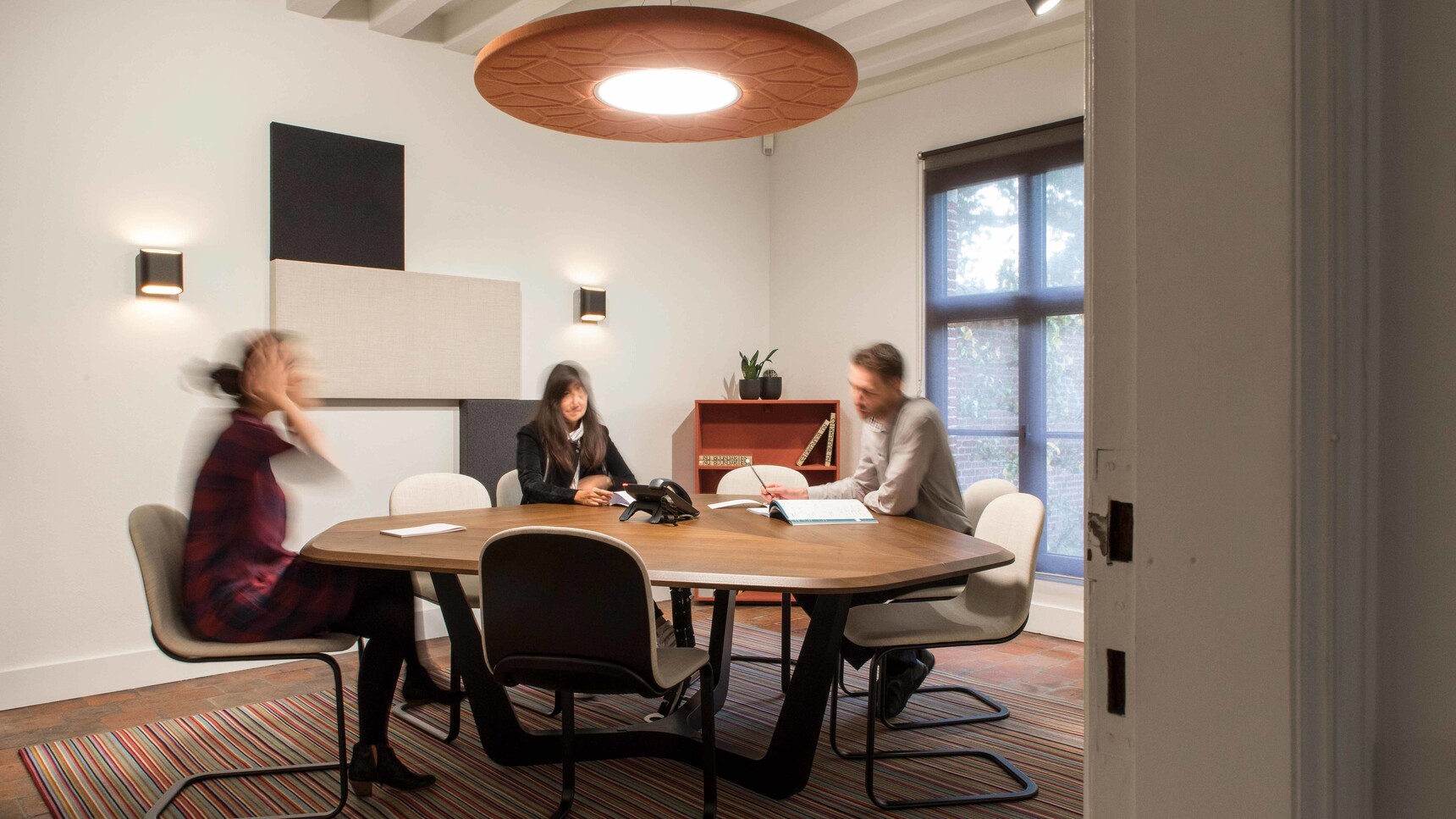 Buzzi Space BuzziMoon Round LED Light With Orange Upholstery Family Image In Meeting Room