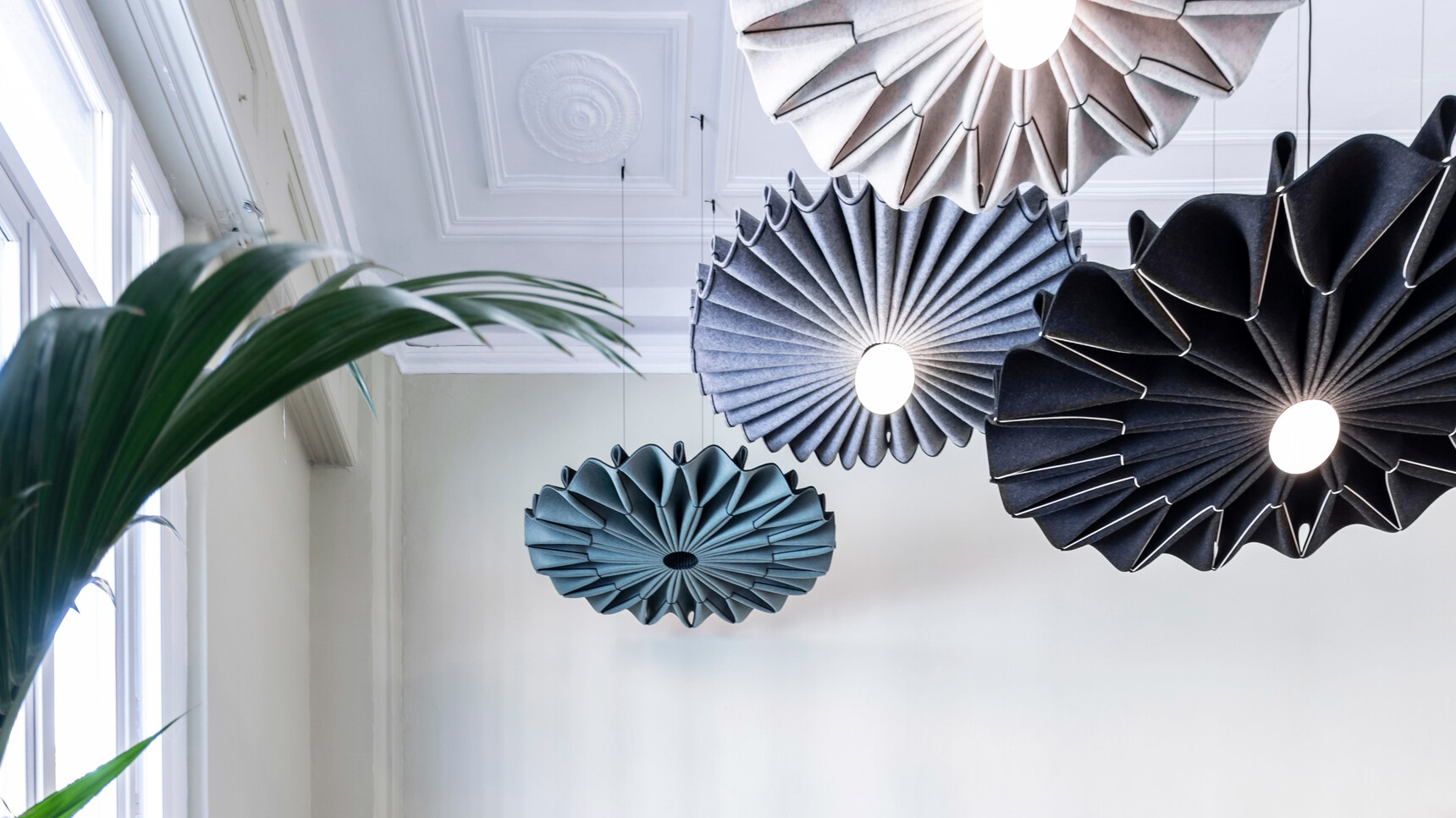 Four BuzziPleat LED Edel Lights In Various Colours Family Image In Office Setting