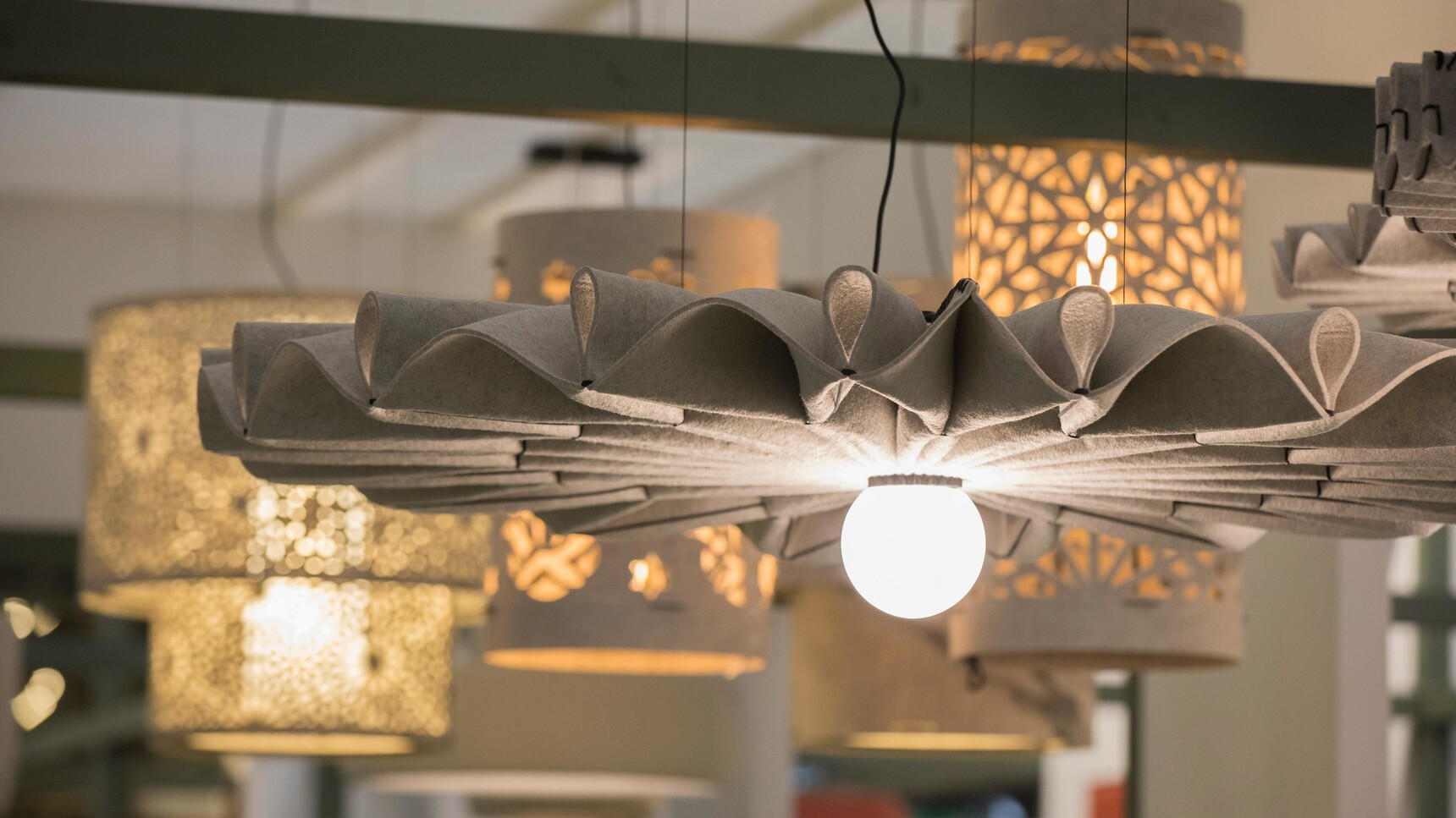 Buzzi Space BuzziPleat LED Edel Light In Light Grey Finish Detail Image With Buzzi Lights In The Background