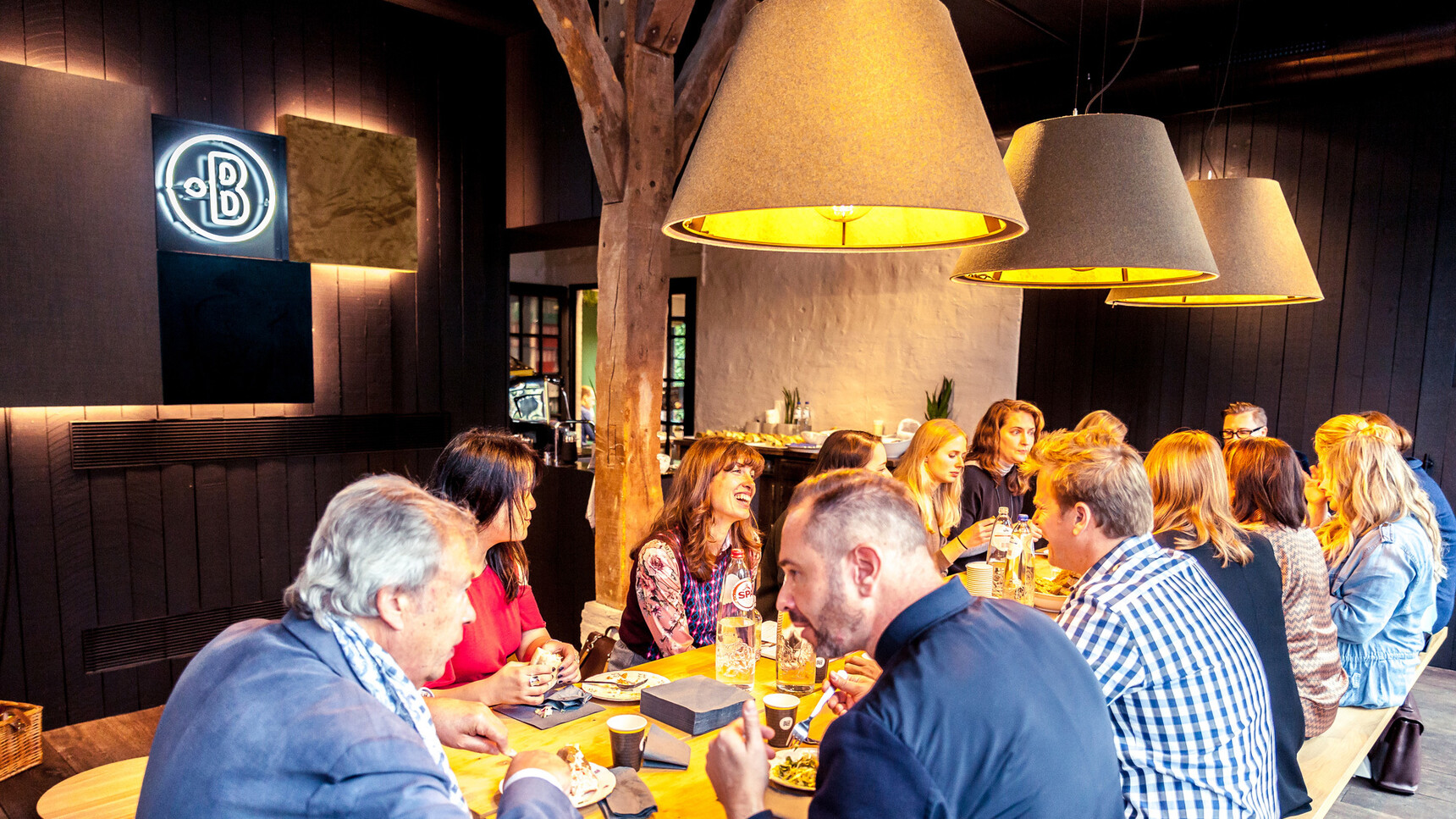 Three Buzzi Space BuzziShade Pendant LED Lights In Grey Upholstery In Dining Area