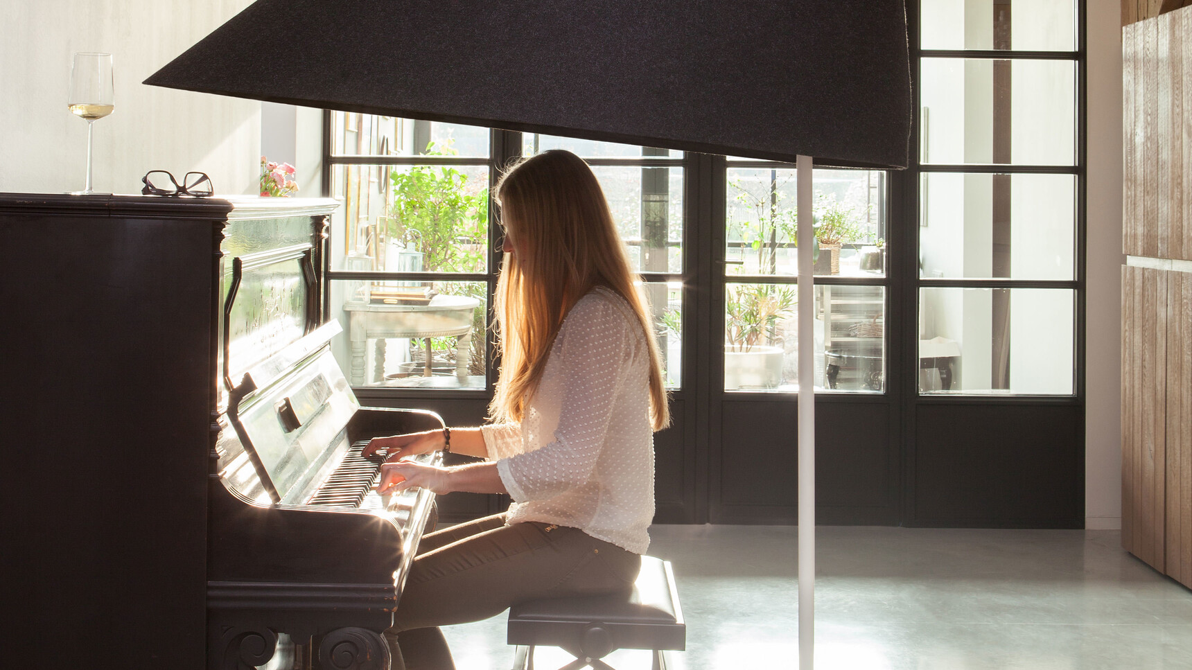 Buzzi Space BuzziShade Floor Standing Lamp With Black BuzziFelt Fabric Upholstery And White Frame At A Piano