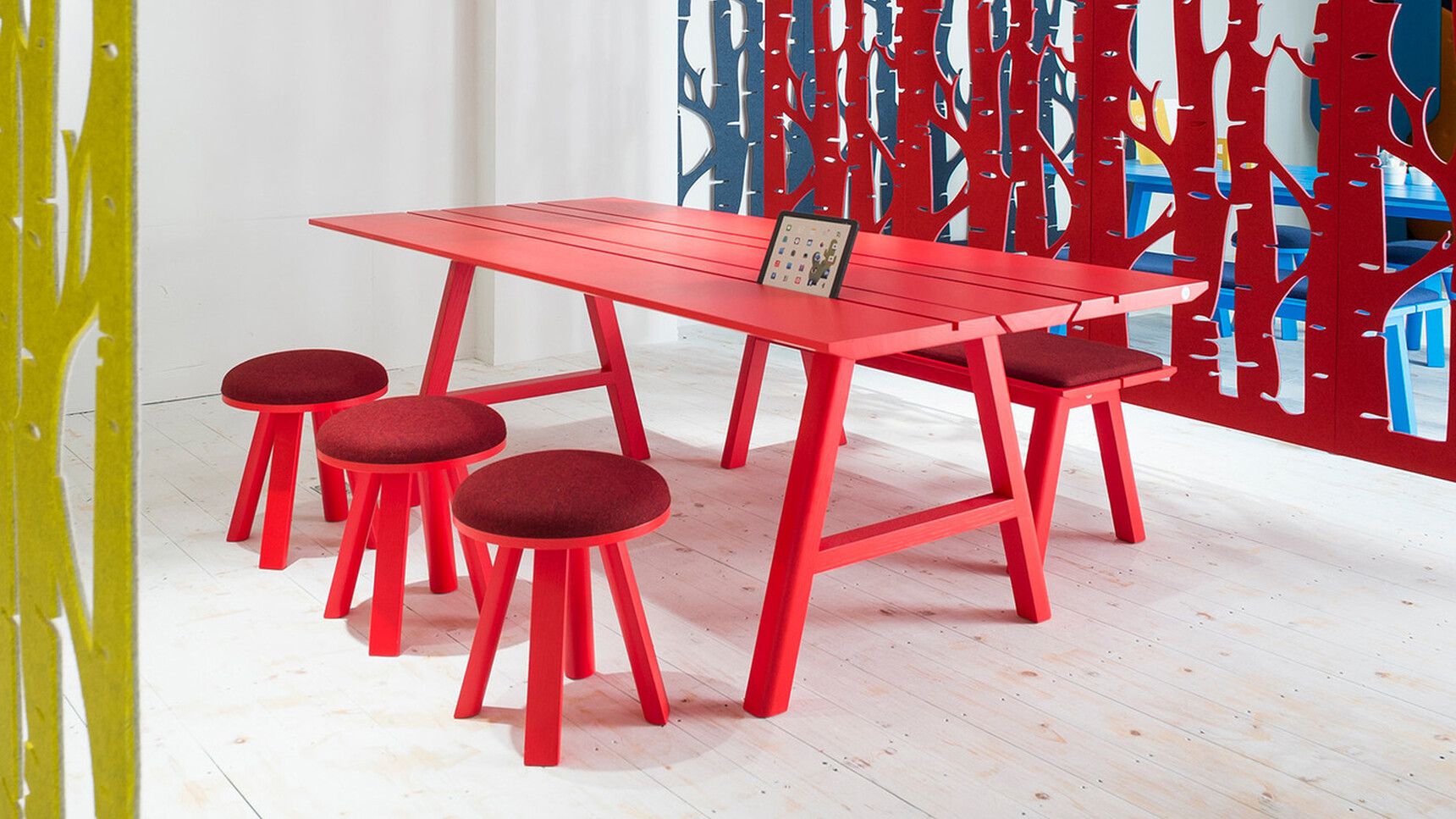 Three Buzzi Space BuzziMilk Stools At Table In Red Family Image