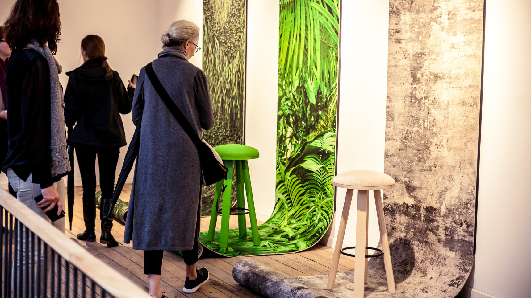 Various Buzzi Space BuzziMilk Bar Stools In Showroom Setting With People Detail Image