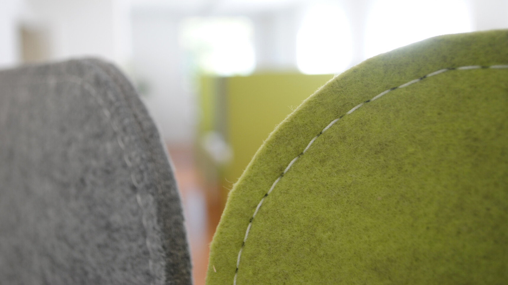 Buzzi Space BuzziScreen Acoustic Partitions In Green And Grey Upholstery Detail Image Of The Top Of The Partition