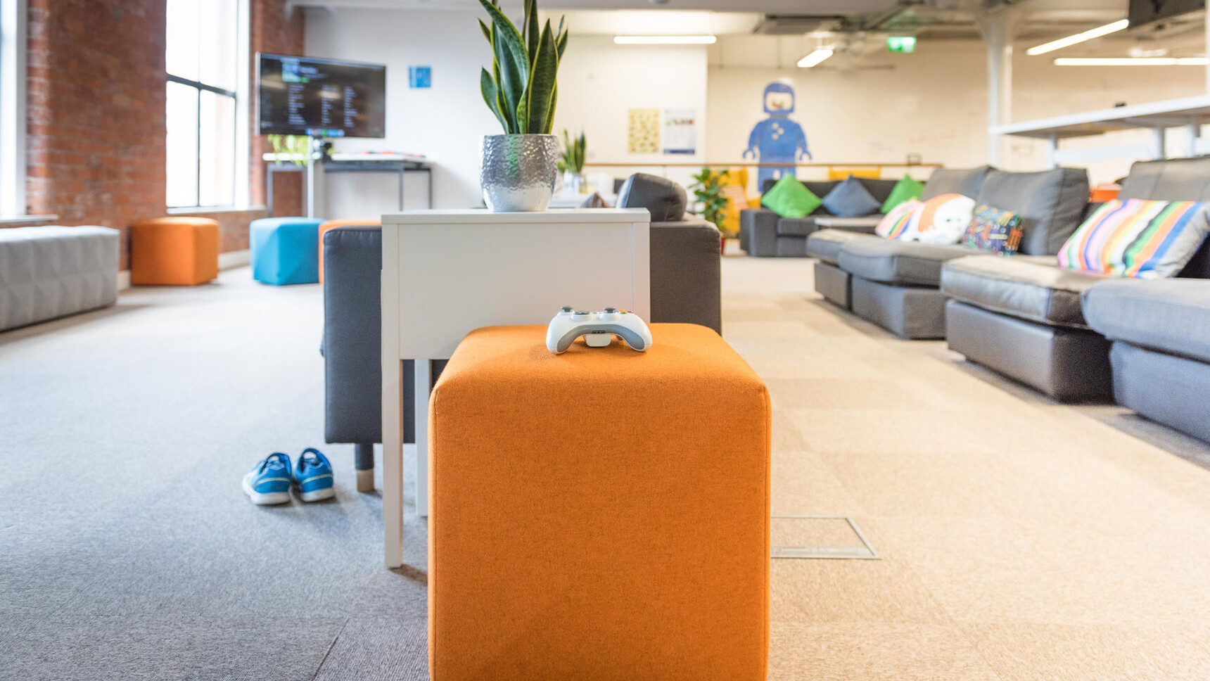 Buzzi Space BuzziCube Flat Pouffe In Orange Upholstery In Office Setting