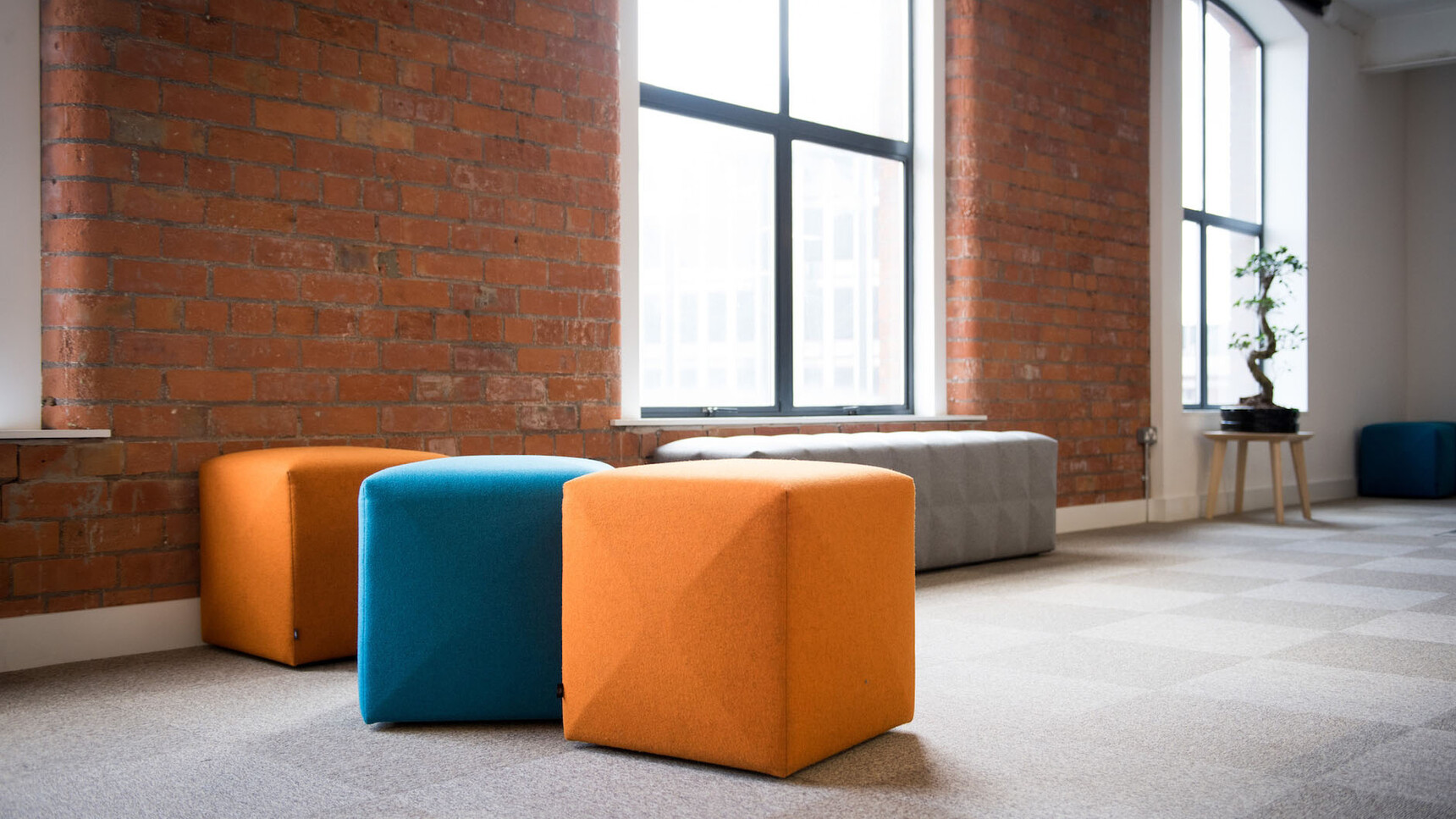 Buzzi Space BuzziCube Flat Pouffe In Orange And Blue Upholstery Family Image In Office Environment