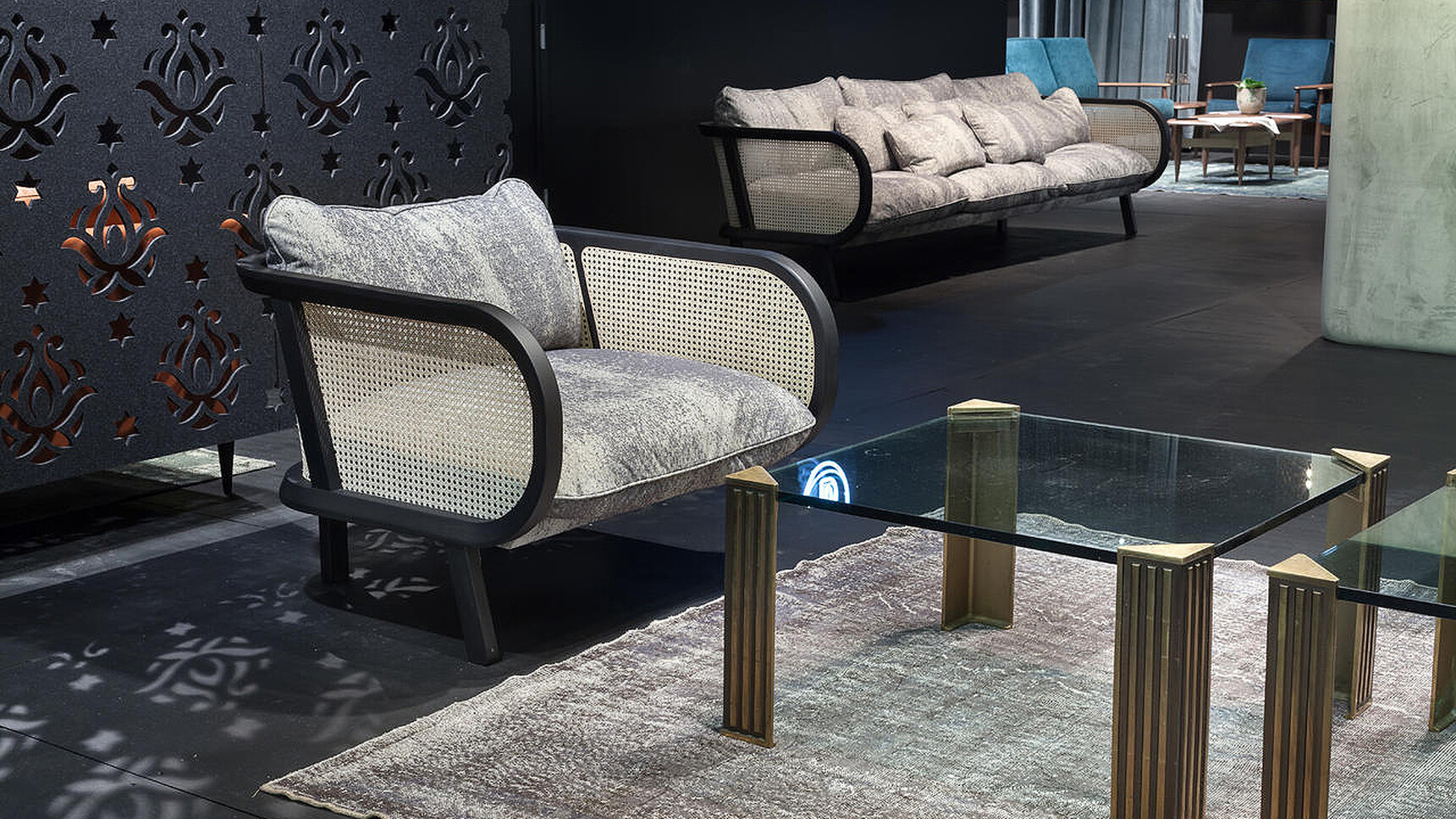 Buzzi Space BuzziCane Lounge Chairs In Grey Upholstery In Showroom Setting