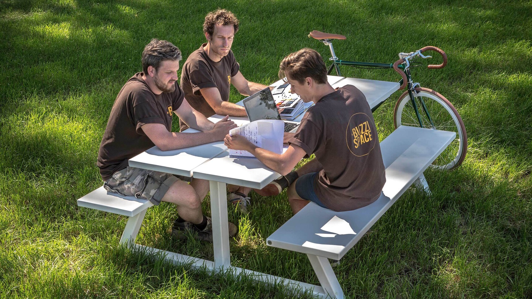 Buzzi Space BuzziBreeze Fixed Bench With White Upholstery Family Image With Three People Using The Bench