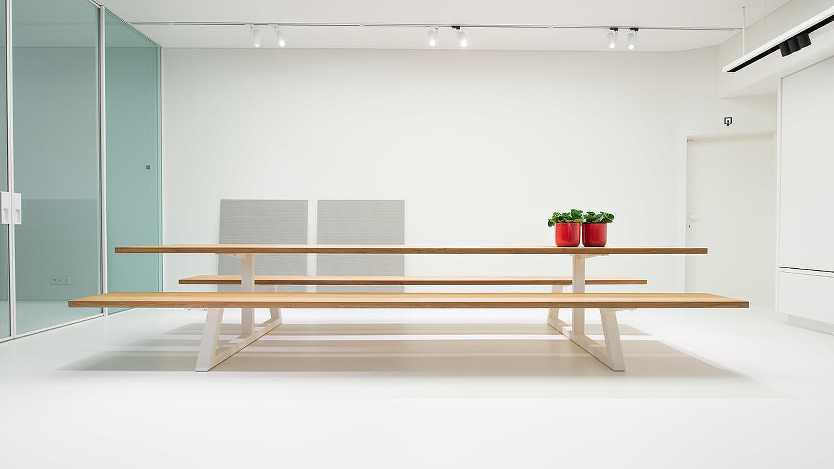 Buzzi Space BuzziBreeze Fixed Bench With Wood Finish Family Image In Office Setting