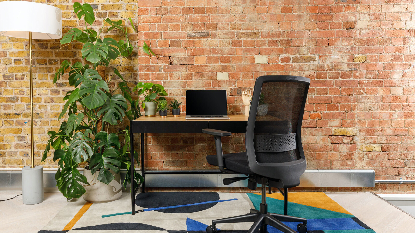 Workstories Surround Workstation Family Image In Home Office With Chair And Plant