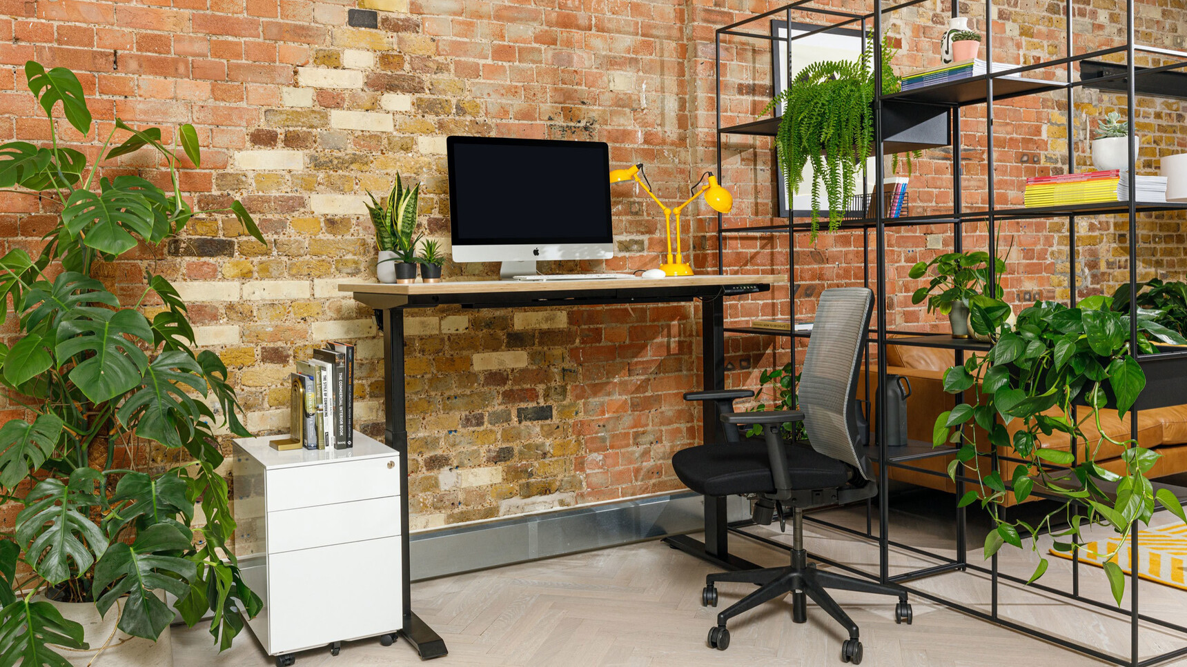 Workstories Sit-stand Height Adjustable Desk With Ply Edge White Finish And Black Legs With Chair At Desk Family Image