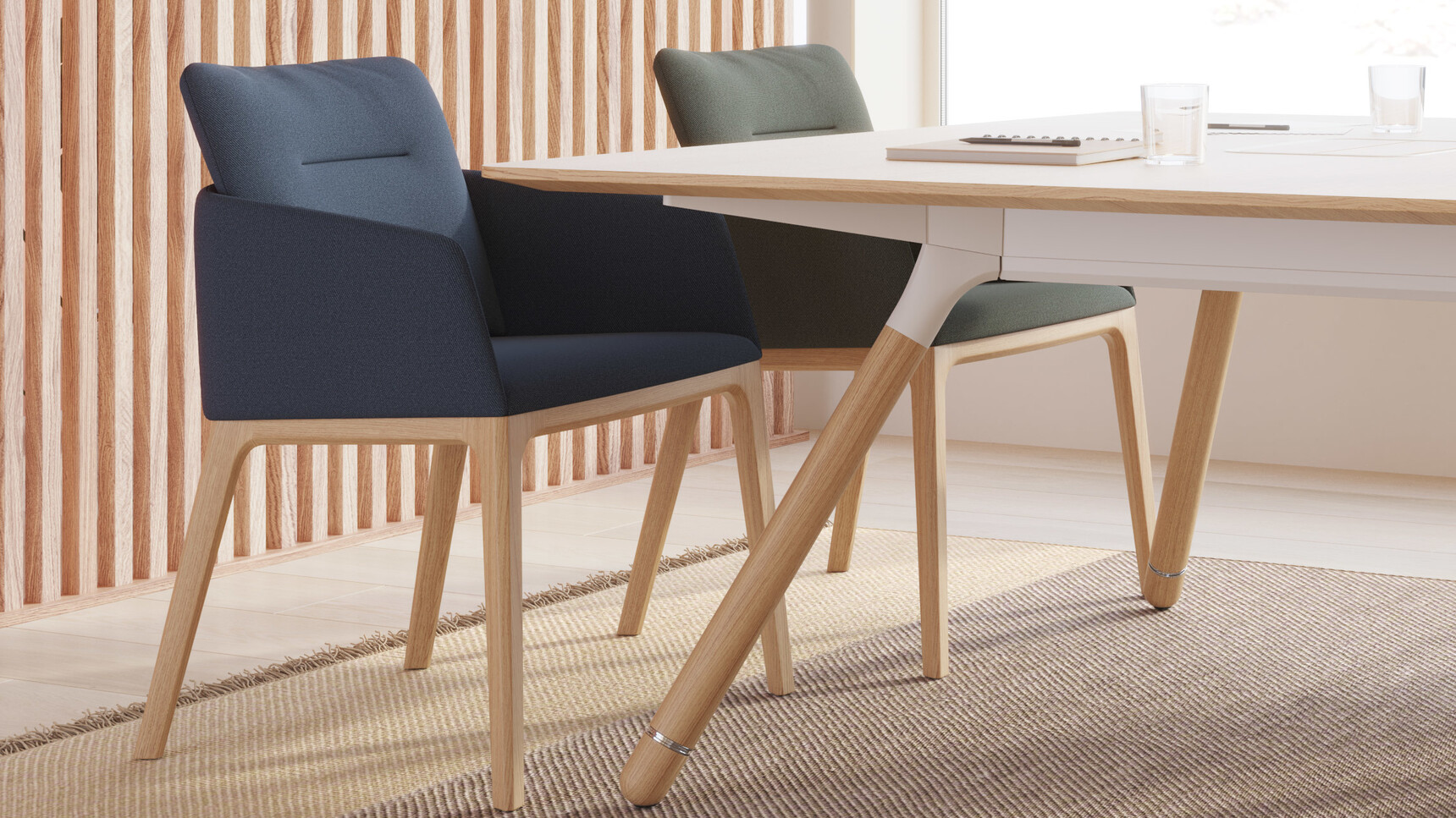 Two Coalesse Marien152 Guest Chairs With Wood Base At Table Detail Image