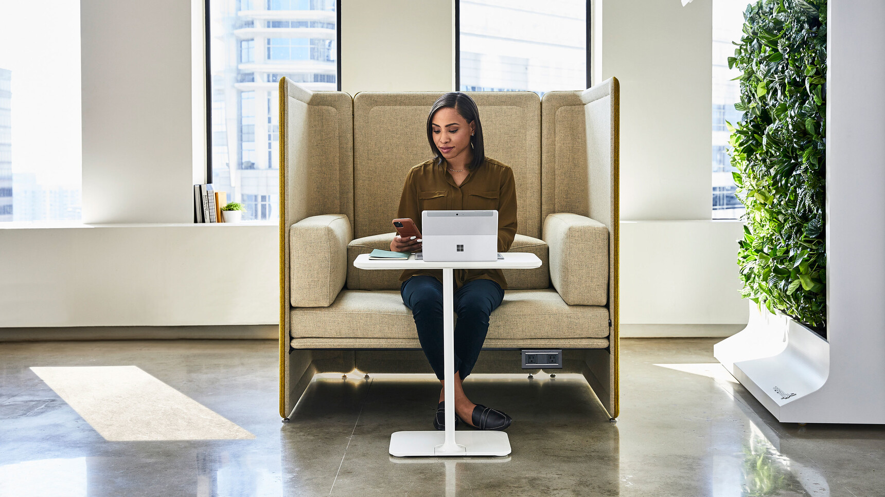 Coalesse Lagunitas Personal Tables In White Finish At Lagunitas Lounge System In Office Setting In Use By A Woman