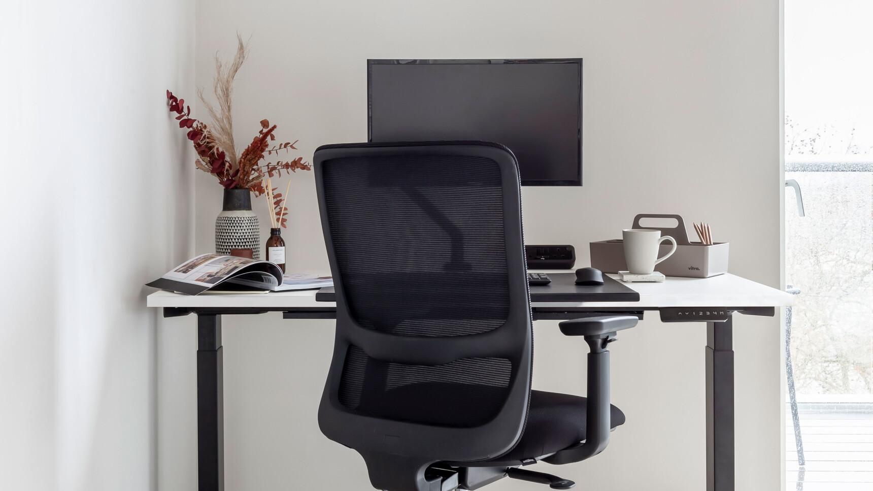 Workstories Sit-Stand Solo Height Adjustable Desk With White Finish In Office Setting Detail Image