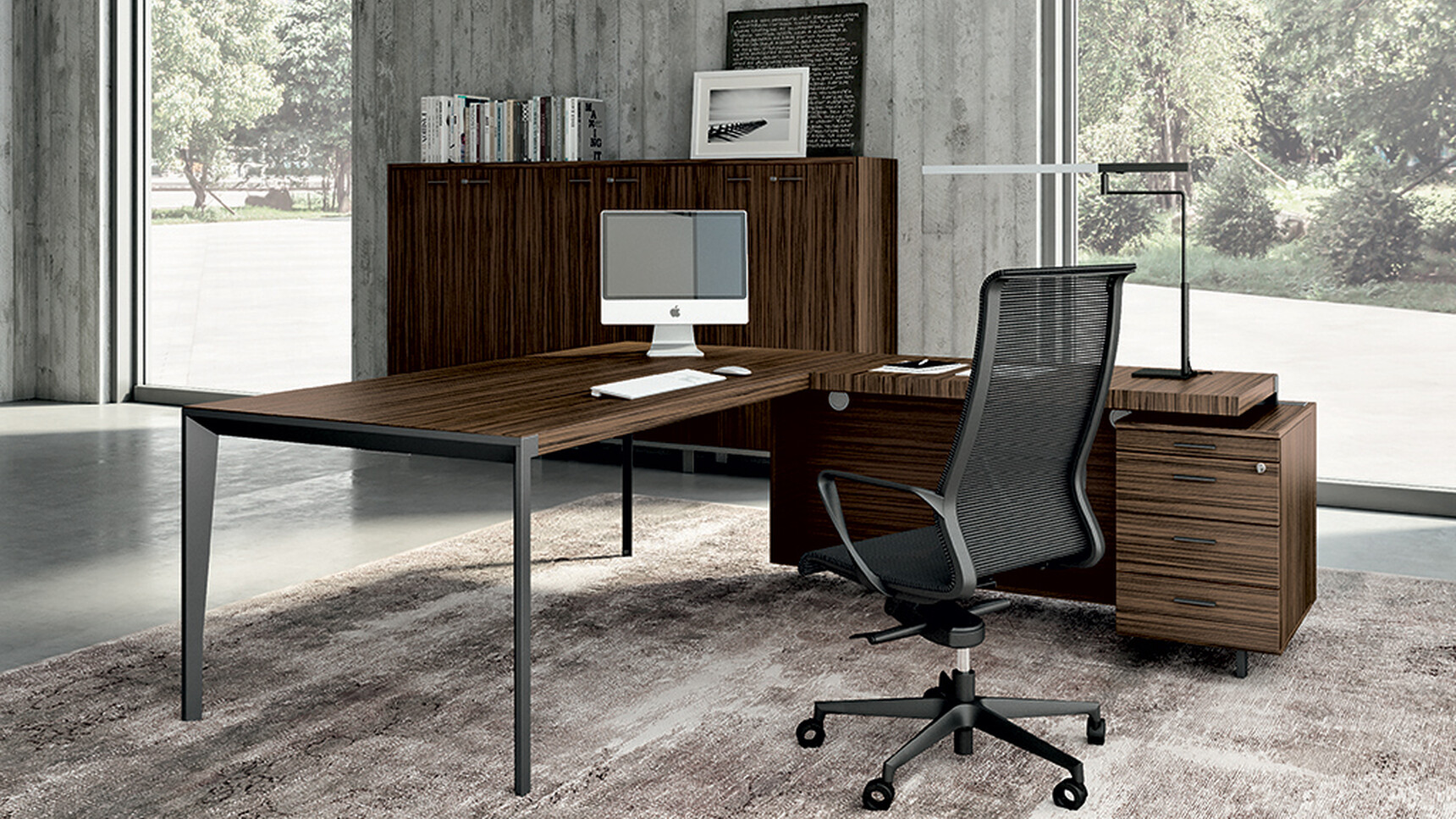 Quadrifoglio X9 Wood Veneer Desk with Return & Pedestal WIth Modesty Panel And Dark Wood Finish And Black Leg Finish With Chair At Desk With Black Upholstery And Black Legs