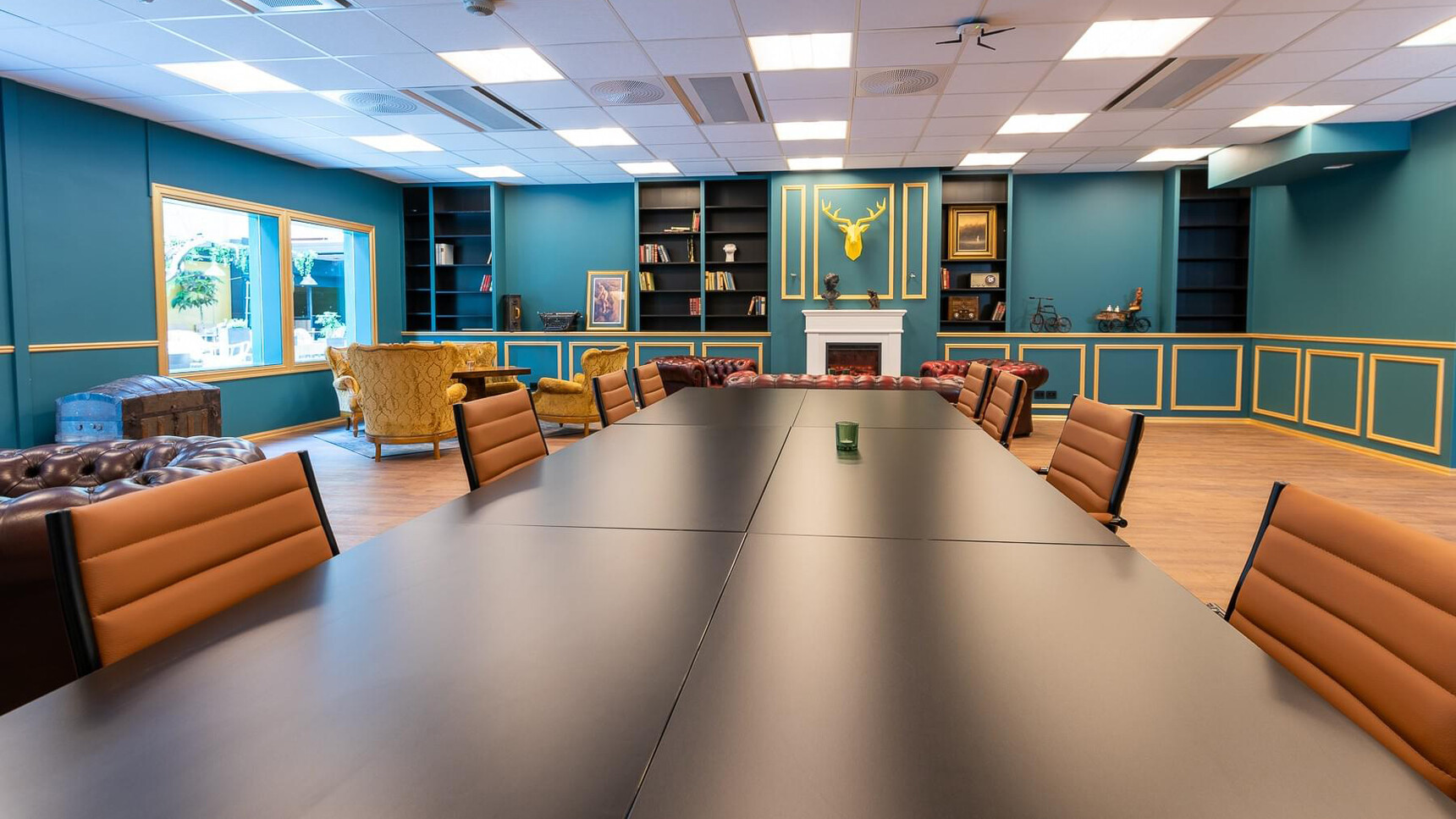 Sitland Classic Low Back Office Chair On Castors With Orange Upholstery At Meeting Table