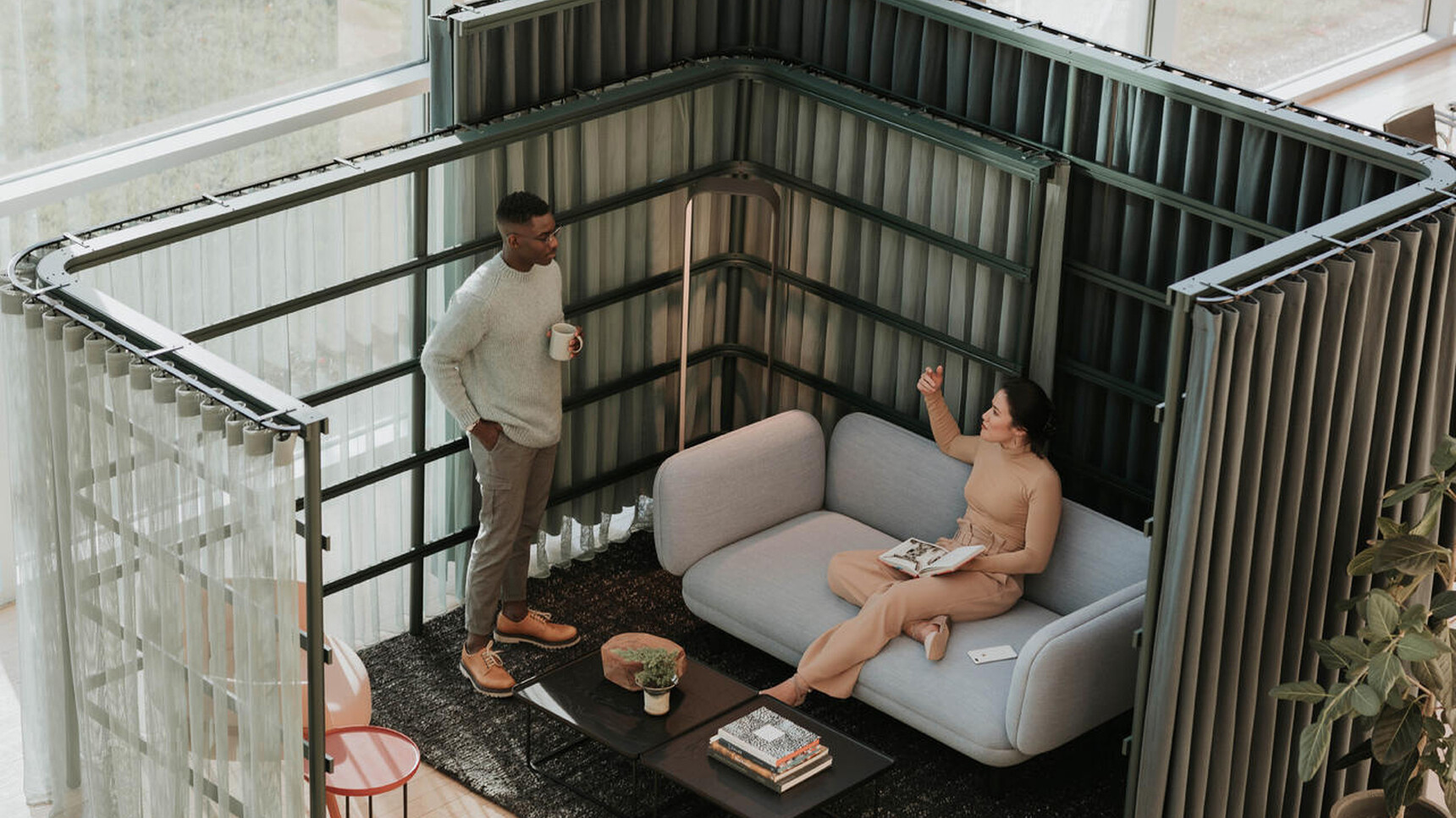 Buzzi Space BuzziBracks Modular Acoustic System In Use By Two People