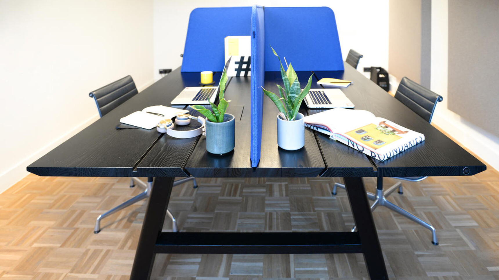 Buzzi Space BuzziDesk Cross Acoustic Desk Divider In Blue Upholstery Detail Image With Plants