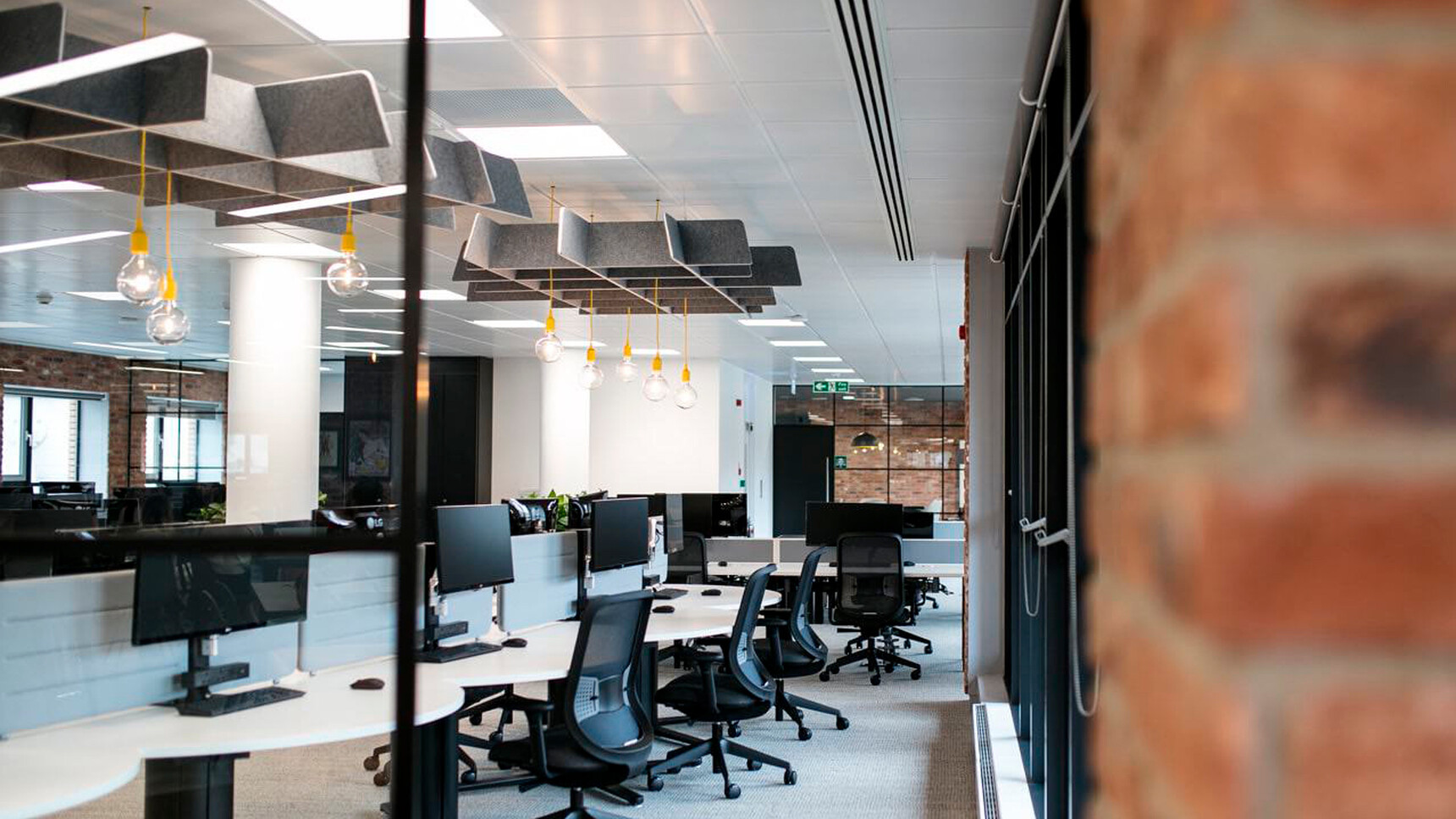 Two Buzzi Space BuzziGrid Acoustic Ceiling Elements Grey Fabric In Office Setting