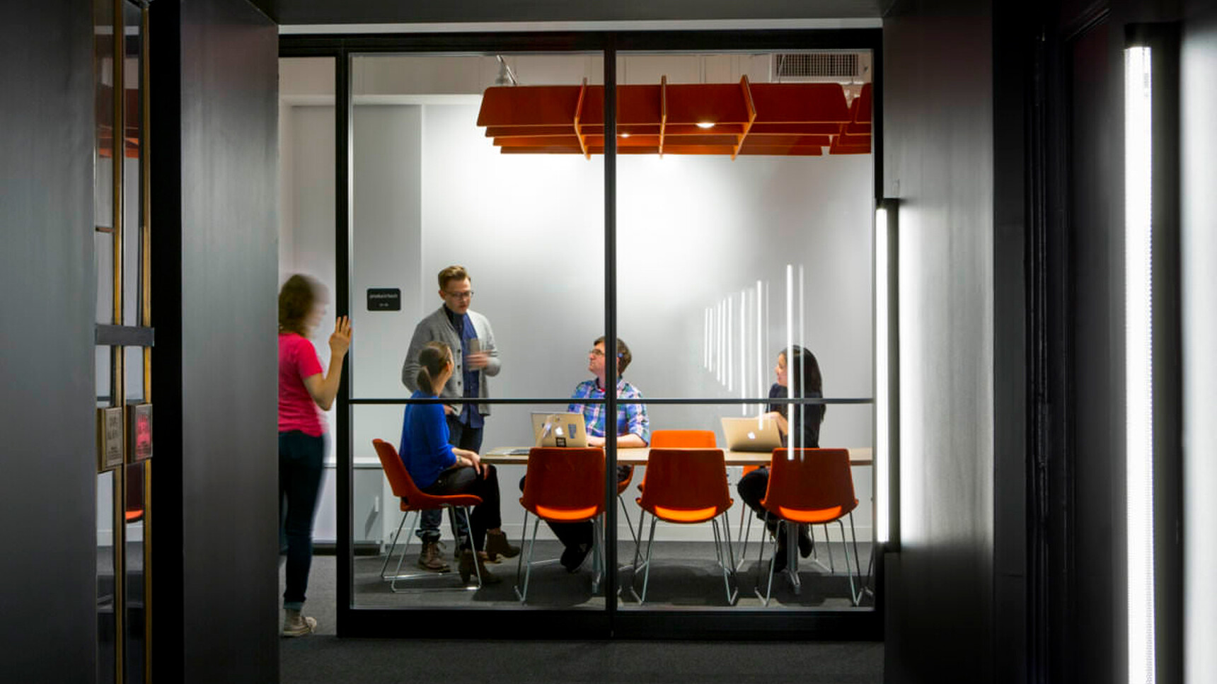 Buzzi Space BuzziGrid Acoustic Ceiling Element Orange Fabric In Office Setting